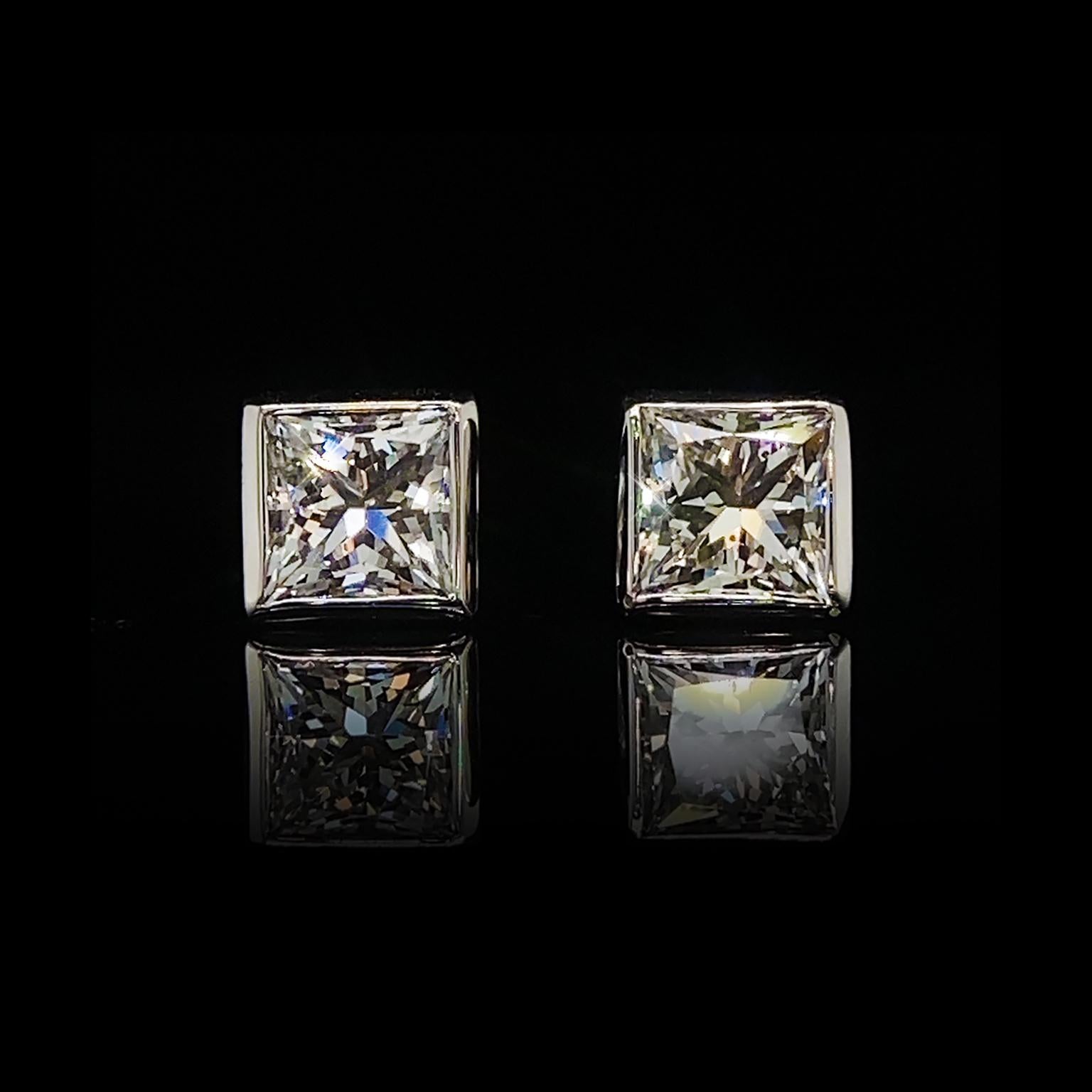 Contemporary 18K White Gold Bezel Set Princess Cut Diamond Stud Earrings For Sale