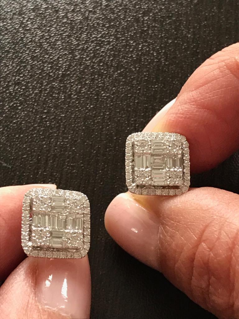 Square earrings set in 18K white gold. This illusion Earrings is set with a cluster of baguette and round diamonds in a halo. The total weight is 2.45 carats. The color of the stones are F, The clarity is VS1-VS2.