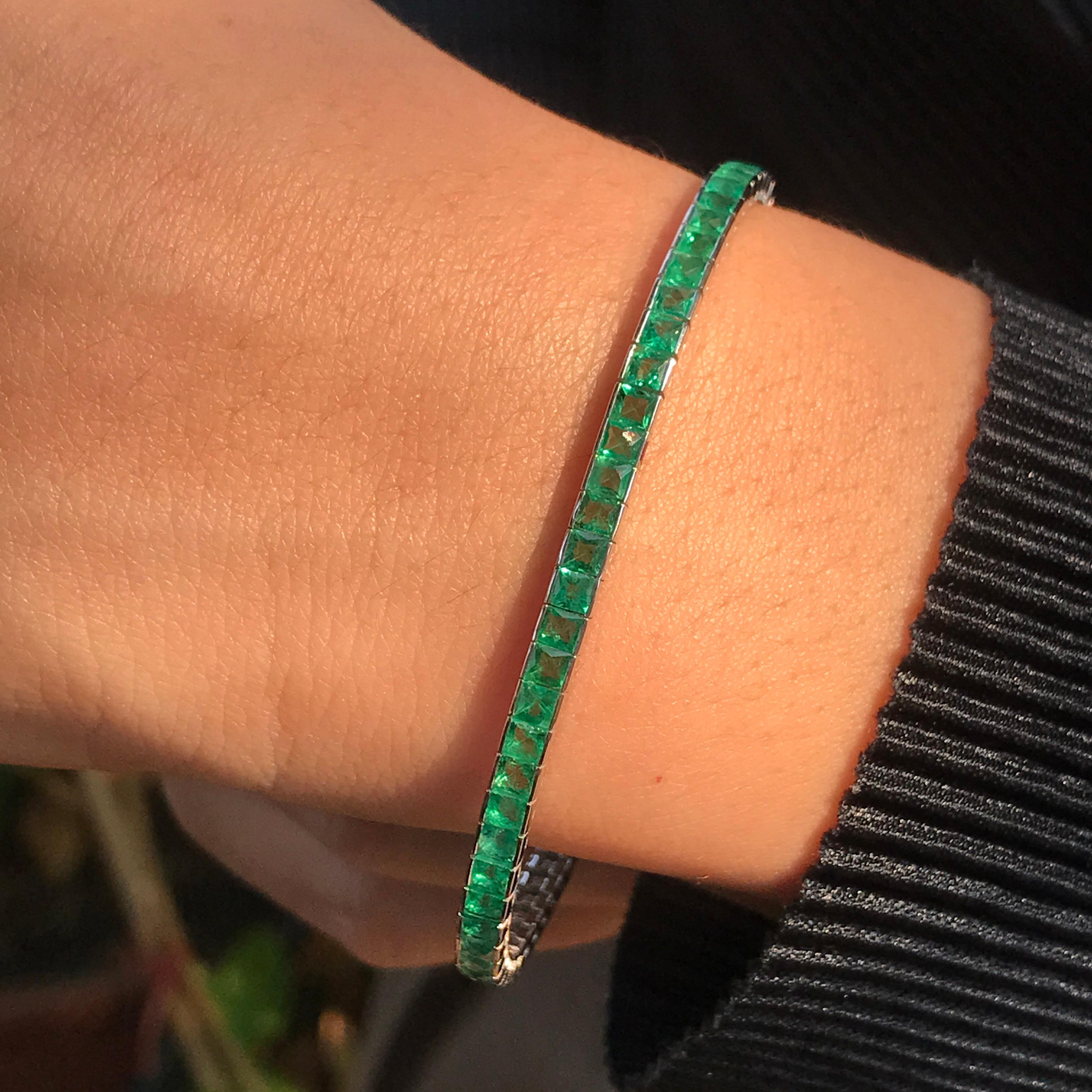 Enviably cool and sophisticated, this princess cut  emerald tennis bracelet reinterprets a familiar motif to create a tennis bracelet that is both contemporary and classic. Made of 18k white gold that contrasts beautifully with green emeralds, with