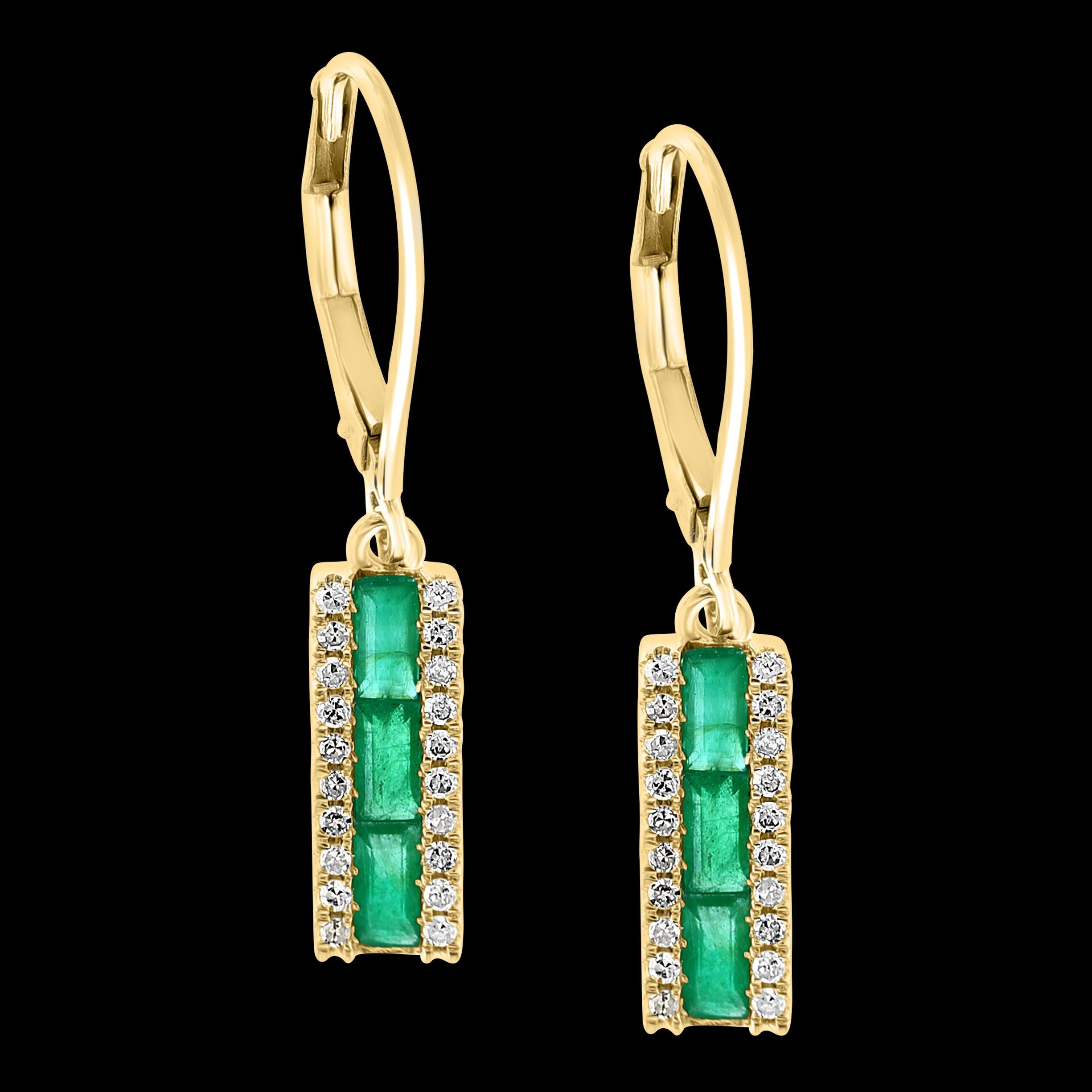 
Princess Cut  Emerald & Diamond 14 Kt Yellow Gold Dangling Earring
Princess cut   Emerald in the Center row 
Each side of the emerald is  a diamond row 
  There are approximately 1.5 ct of emerald 
and 0.35 ct of diamonds 
14 Karat yellow gold