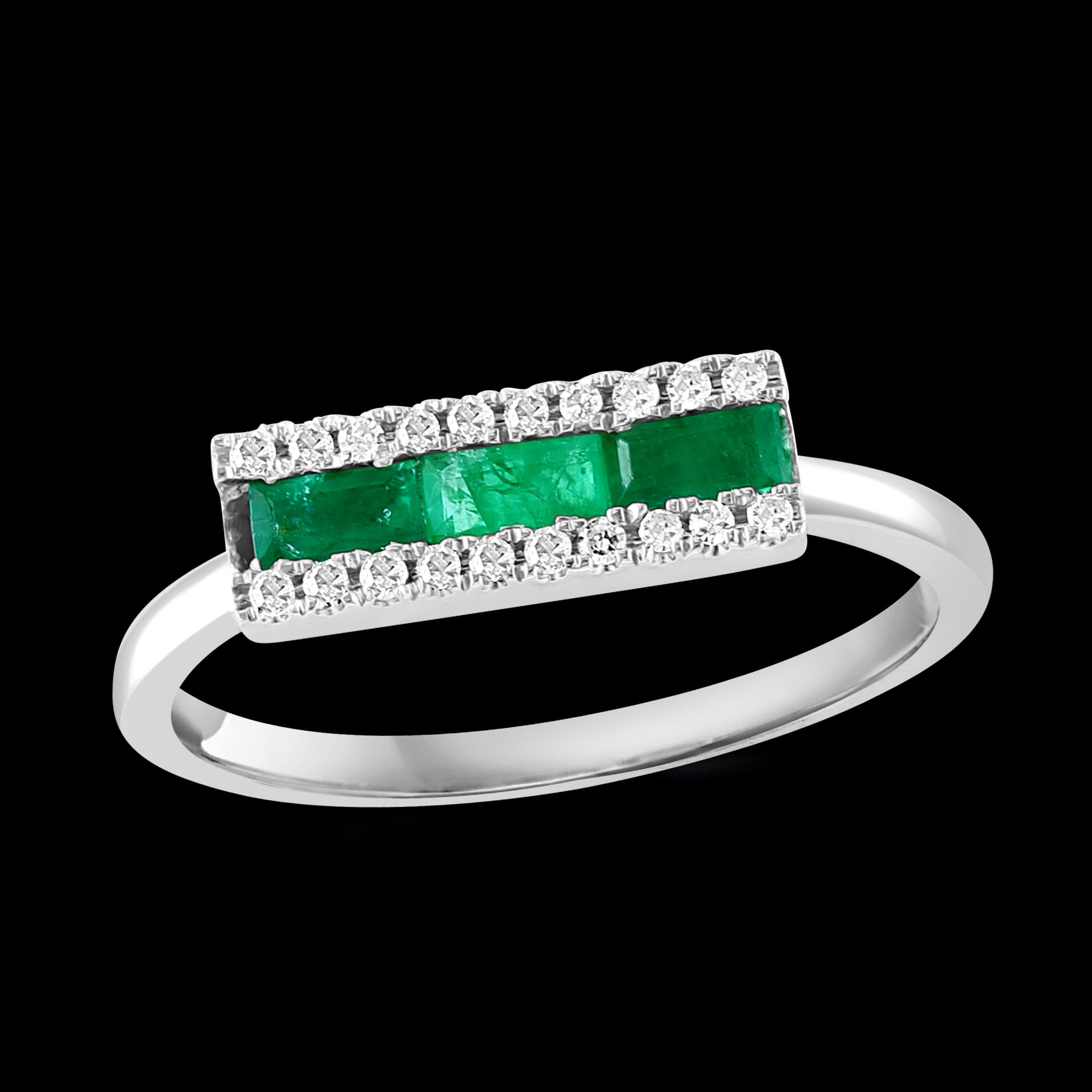 
Princess Cut  Emerald and Diamond Band/Ring 14 Karat Yellow Gold/ White Gold
Princess cut   Emerald in the Center row 
Each side of the emerald is  a diamond row 
  There are approximately 0.6 ct of emerald 
and 0.25 ct of diamonds 
14 Karat yellow