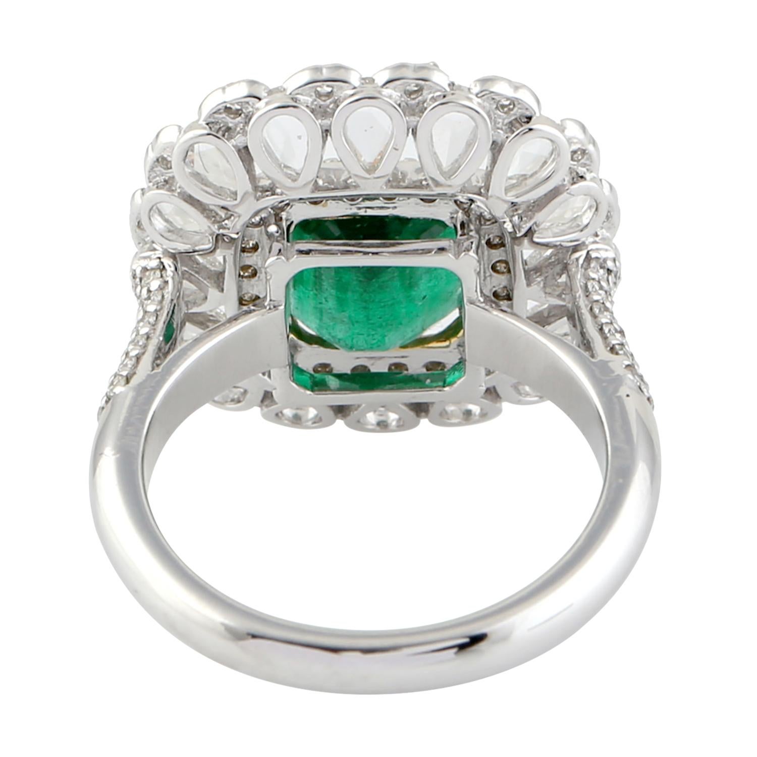Princess cut Emerald Ring with pear shape rose cut diamonds around in 18K White Gold is pure luxury.

Ring Size 7

18t White Gold 7.432gms
Diamond 1.89cts
Natural Zambian Emerald 2.5cts
