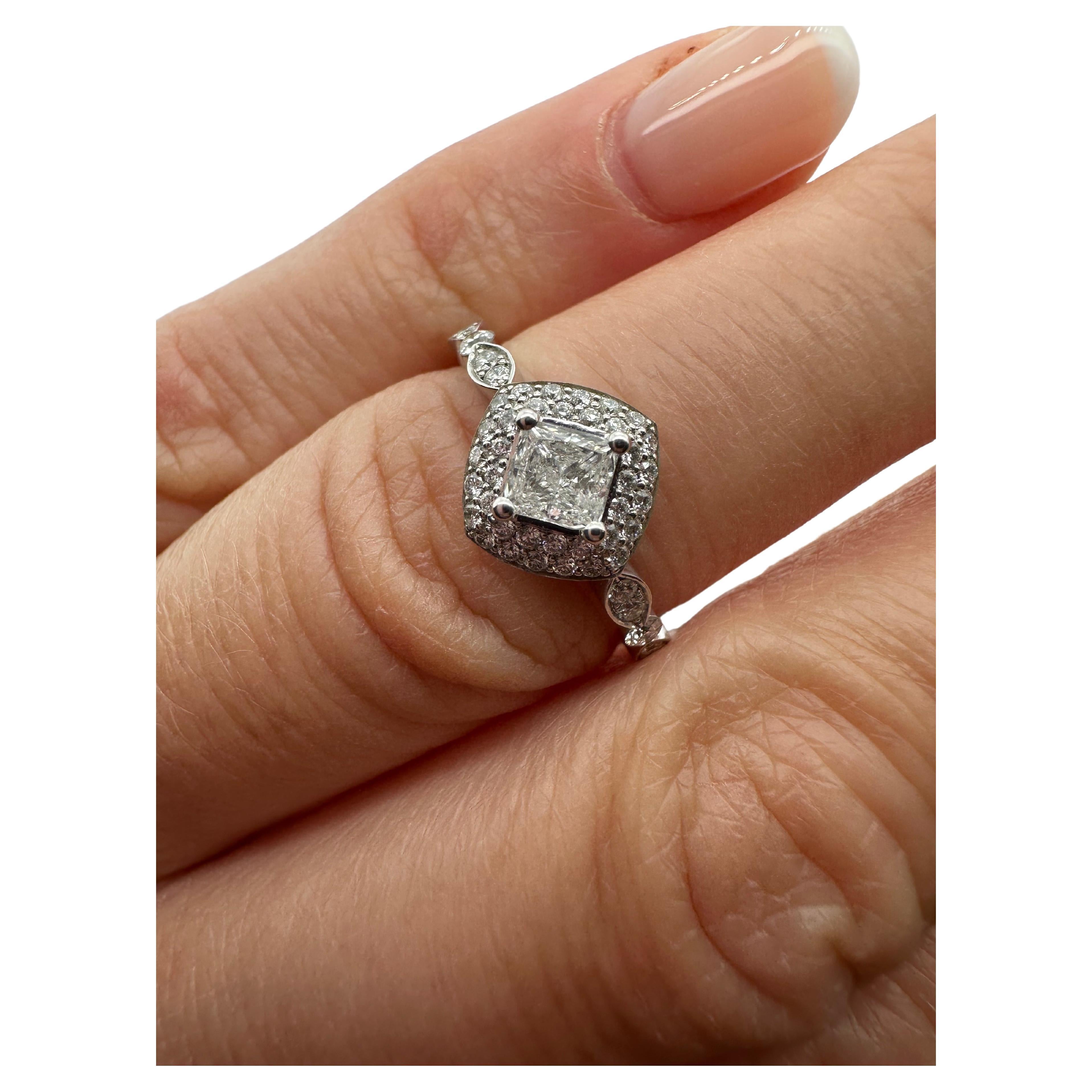 Complex diamond ring with princess cut diamond in center and pave set diamonds in doubke halo, made with marquise design and Victorian motif in 18KT white gold!

Metal Type: 18KT

Natural Diamond CENTER(s):
Color: G
Cut:Square Brilliant(Princess