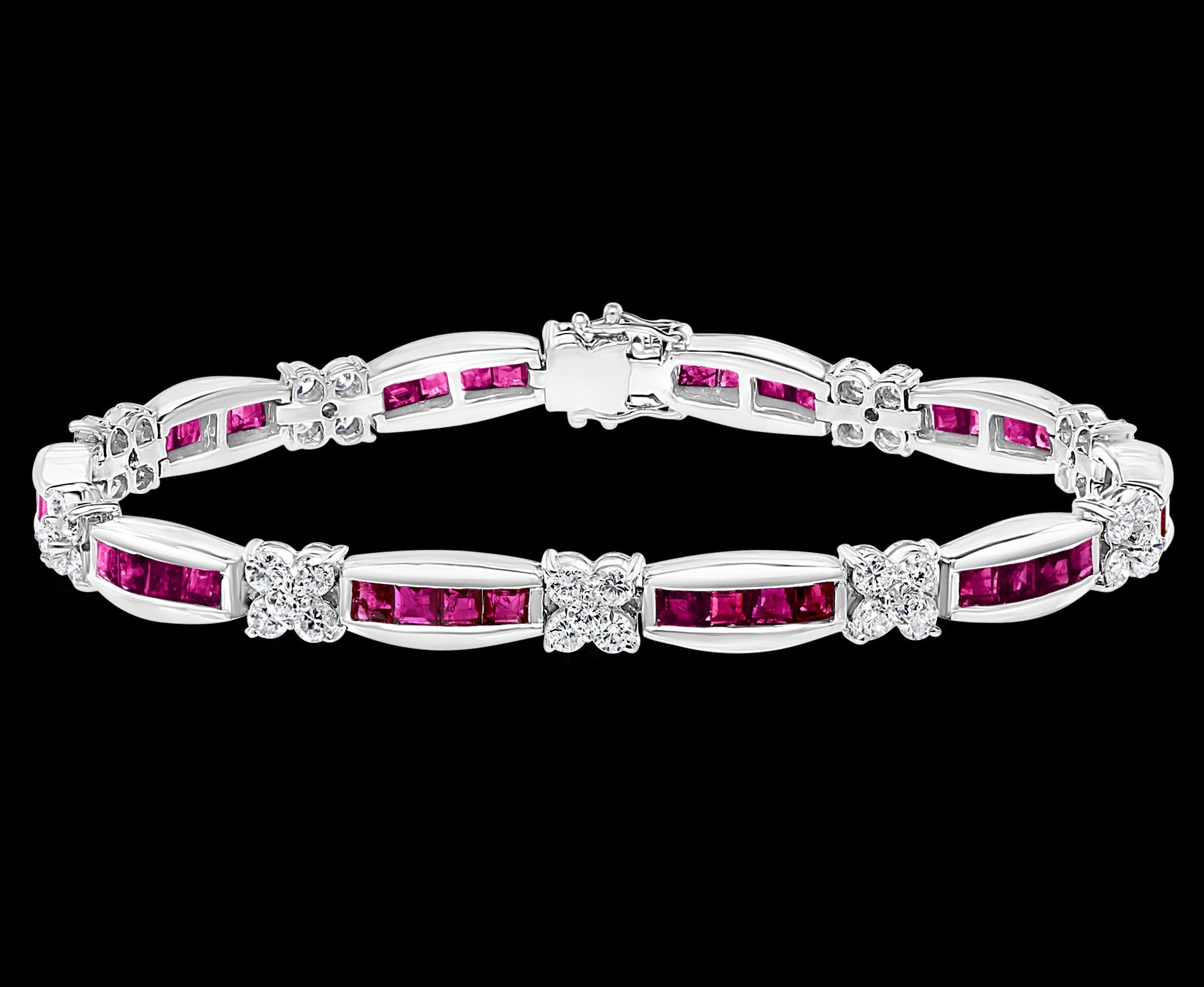  A beautiful ruby and diamond line bracelet set in 18 karat white gold. 
The bracelet is made up of 40  princess cut rubies Totaling Approximately  5 ct. The rubies are set in horizontal rows of 4, with 10 rows in total. 
Each row is separated with