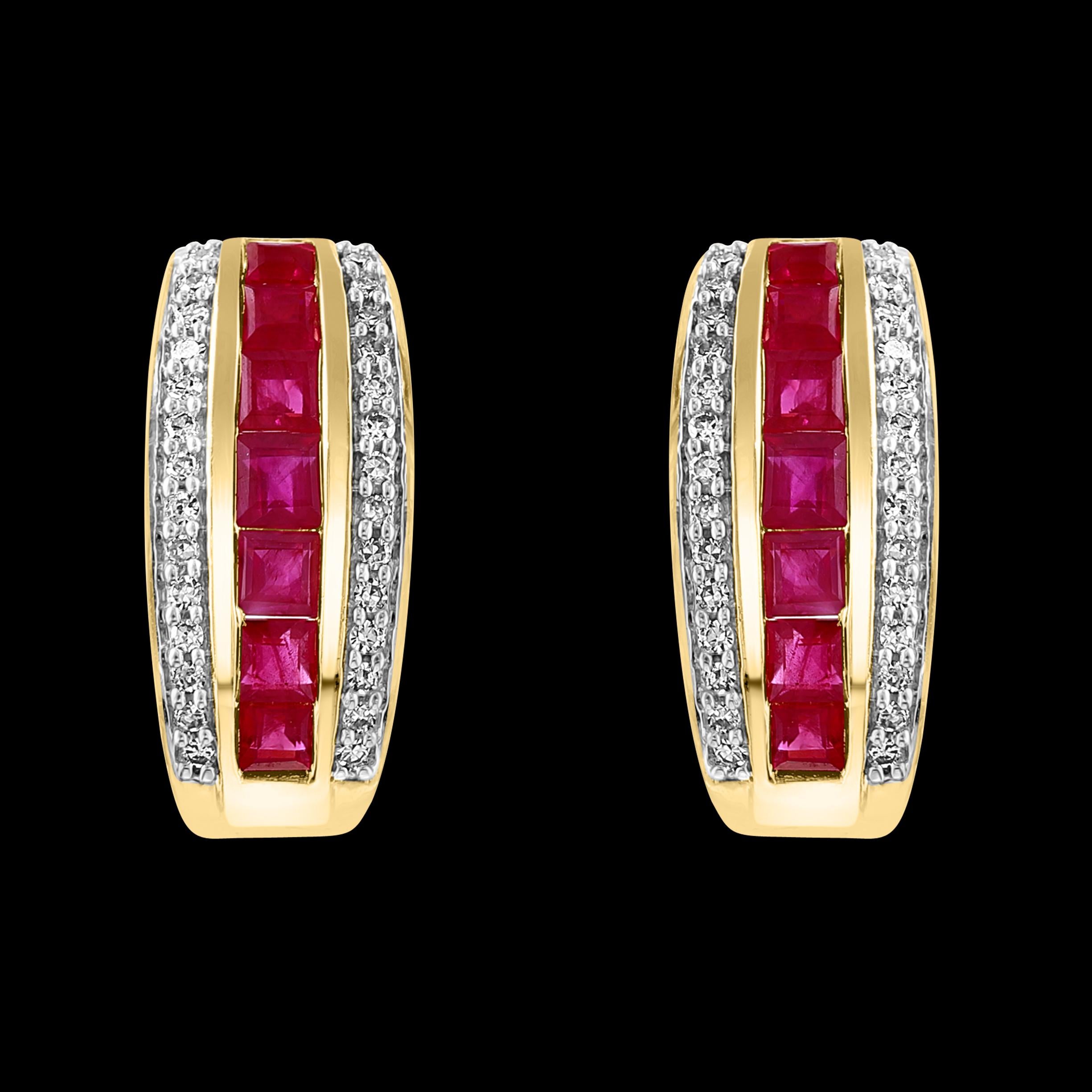 Princess Cut Natural Ruby and Diamond Stud Post Earrings 14 Karat Yellow Gold
This luxurious pair of ruby earrings is designed in 14K Yellow gold. The Princess cut , Invisibly set  red Rubies are surrounded by a dazzling round diamonds.
Natural Ruby