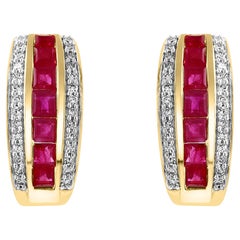 Pendientes de rubí natural talla princesa y diamantes en oro amarillo de 14 quilates