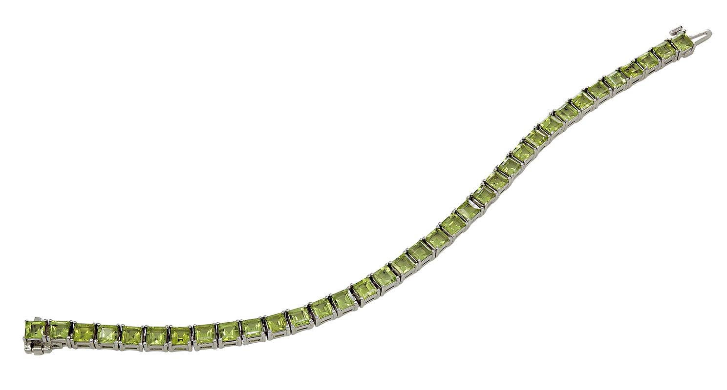 A dainty and stylish Peridot tennis bracelet set in white gold material. There are 35 sparkly stones.

Length: 7 inches
