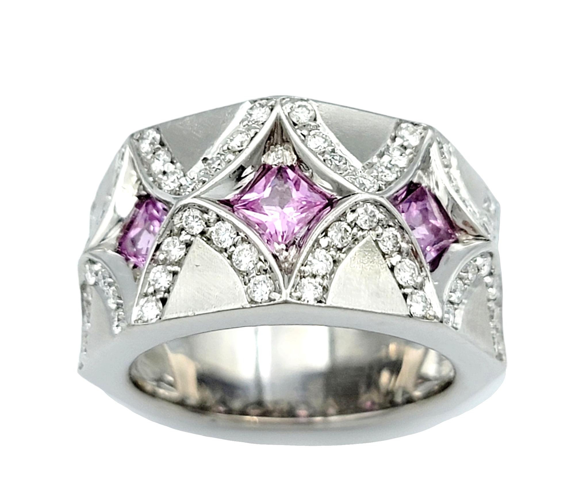 Ring Size: 7.25

Elegance meets originality in this exquisite band ring, a true masterpiece set in 18 karat white gold. This ring consists of five stunning princess-cut pink natural sapphires, set along the ring's band. These vibrant pink sapphires
