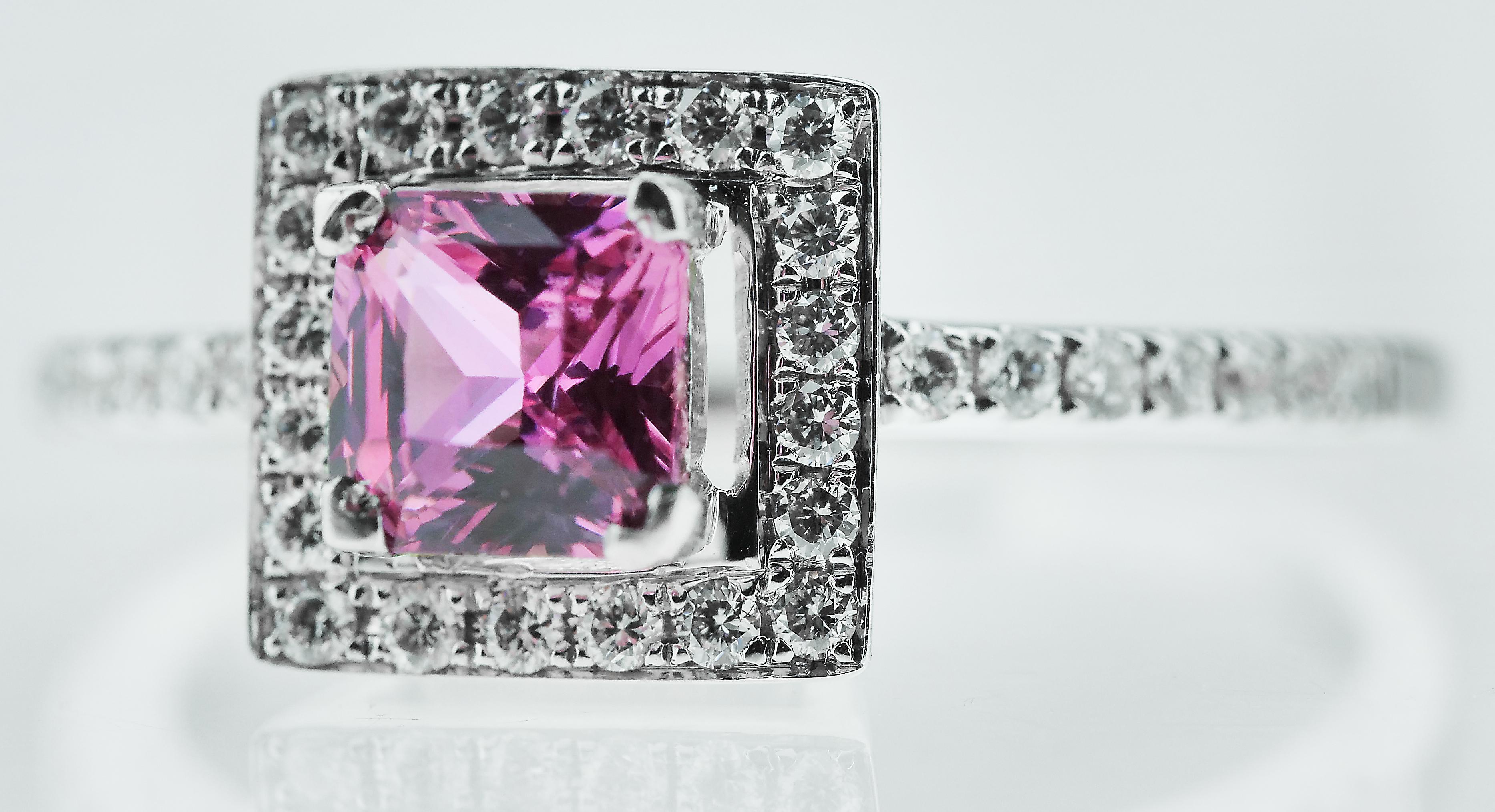 Princess cut pink sapphire center and surrounded by round brilliant cut diamonds square cluster ring set in 18k white gold.
34 x round brilliant cut diamonds, approximate total weight 0.30 carats, assessed colour H/I, assessed clarity VS
1 x Square