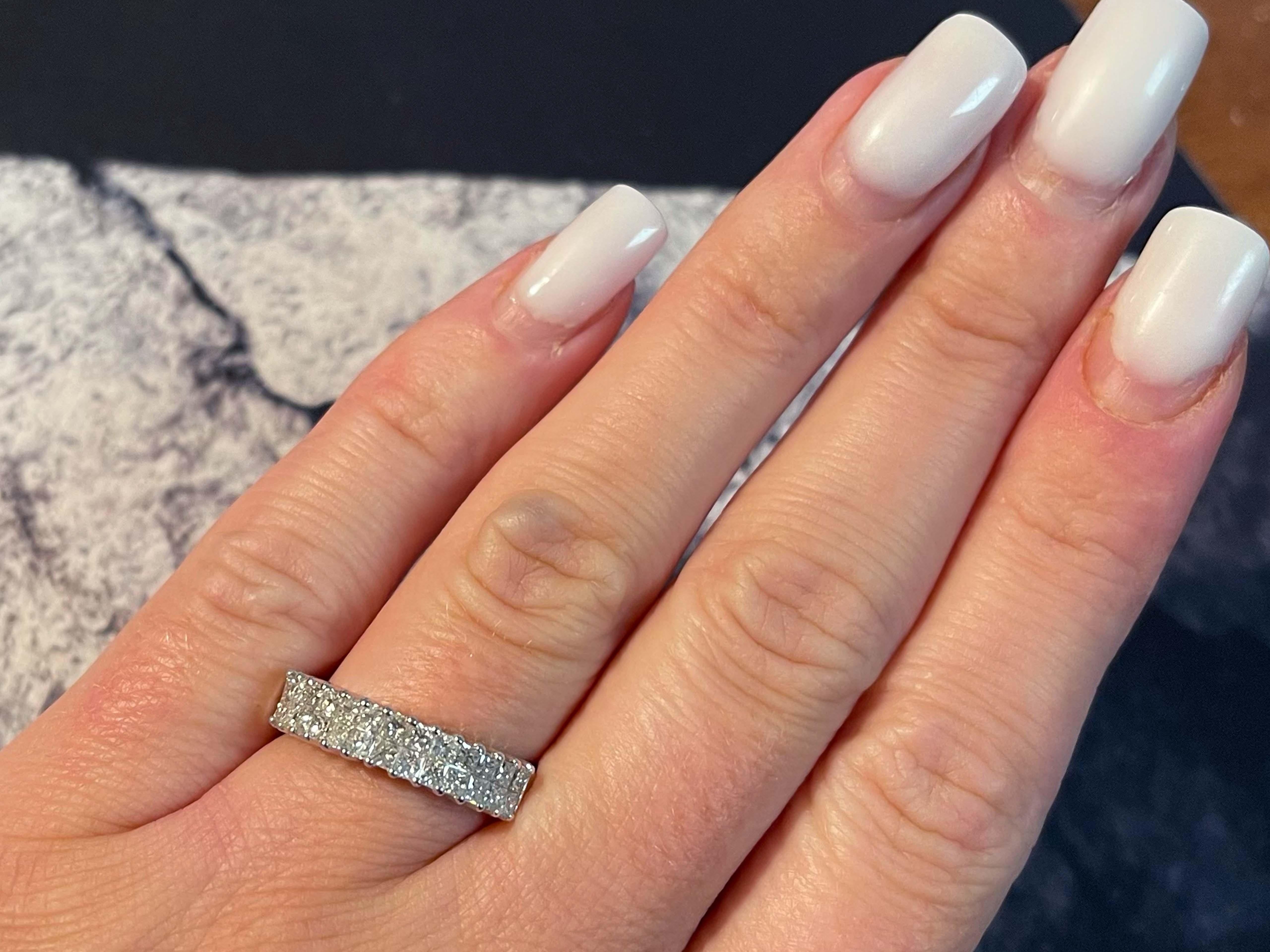 Item Specifications:

Metal: 18k White Gold

Diamond Count: 26 princess cut

Total Diamond Carat Weight: 1.15 carats 

Diamond Color: G-H

Diamond Clarity: SI

Ring Size: 6.5

Total Weight: 4.8 Grams

Stamped: 