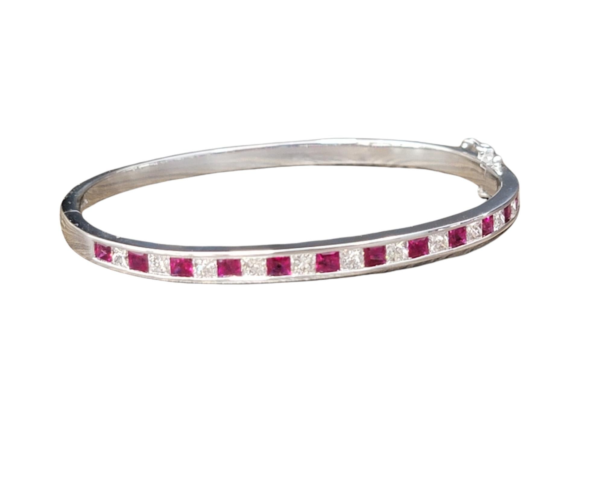 Beautiful bangle bracelet with a bright pop of color! This gorgeous piece absolutely dazzles with its rich red rubies and bright white diamonds. The sleek, linear design paired with the contemporary squared shape of the gemstones, takes this classic
