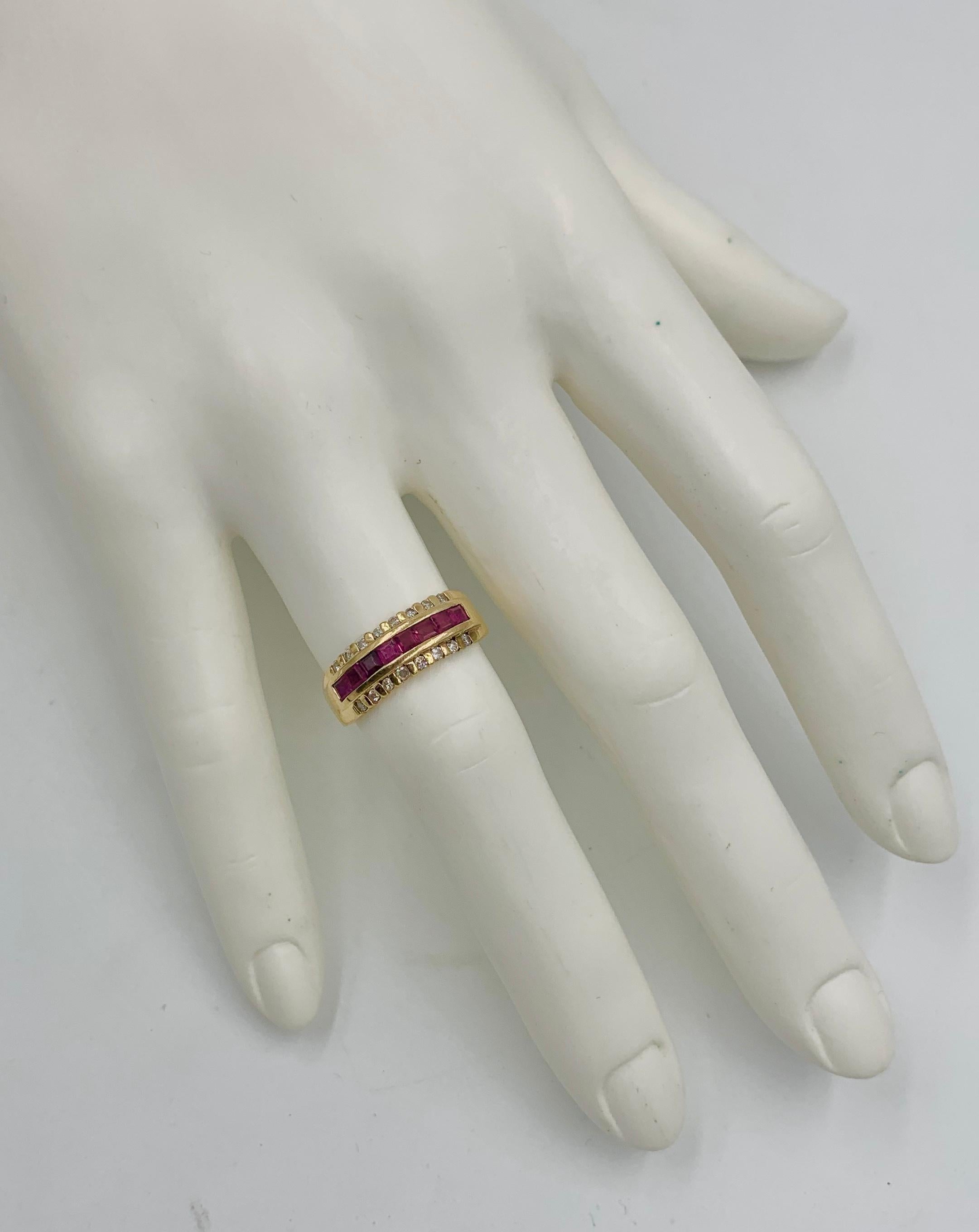 A classic Ruby and Diamond Wedding Engagement Band Stack Ring.  The vivid red Rubies are Princess Cut and channel set creating a magical band of red across the middle of the ring.  On either side of the rubies are a row of sparkling white Diamonds. 