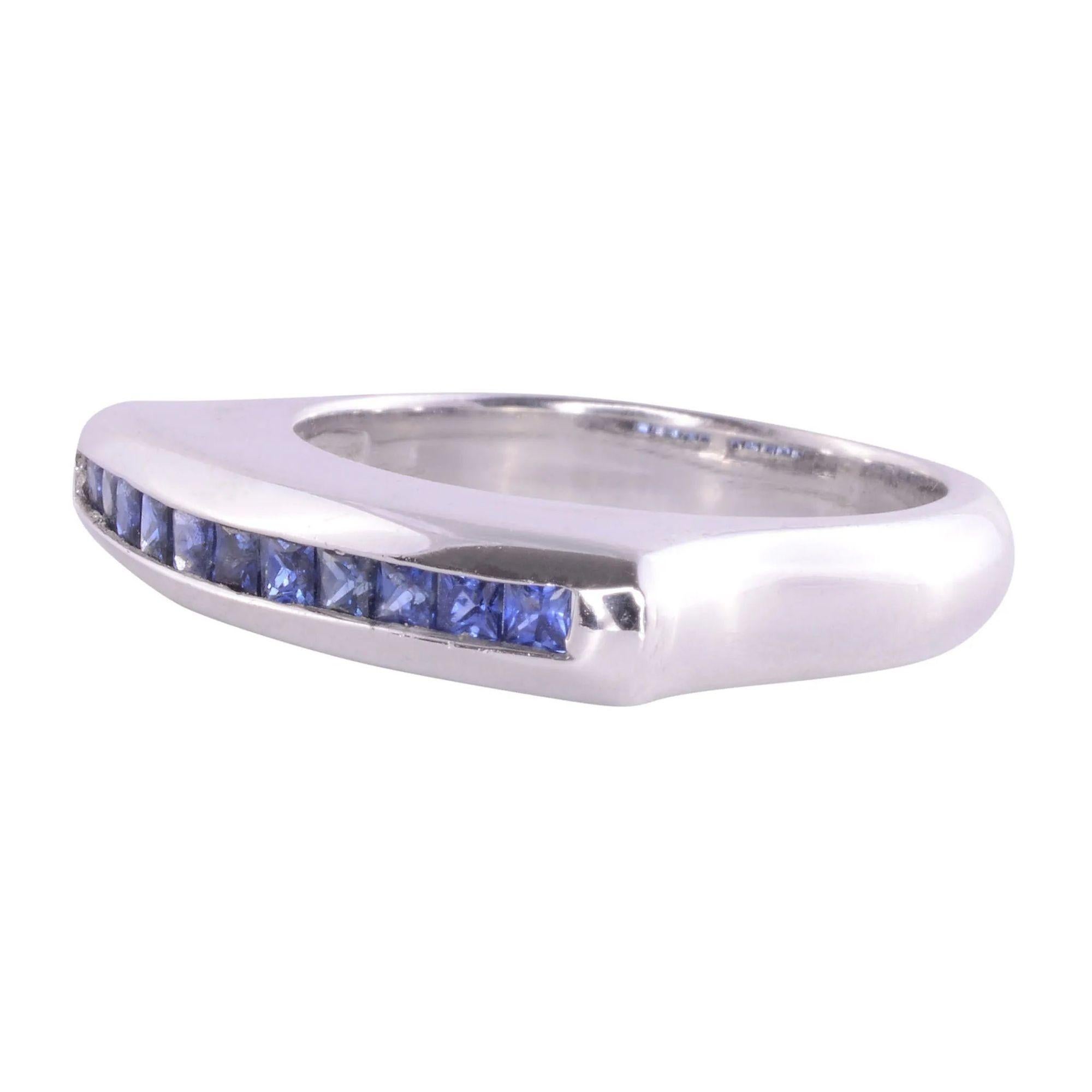 Estate princess cut sapphire 18K white gold band. This 18 karat white gold ring with a row of 11 princess cut sapphires at .50 carat total weight and is a size 6.25.