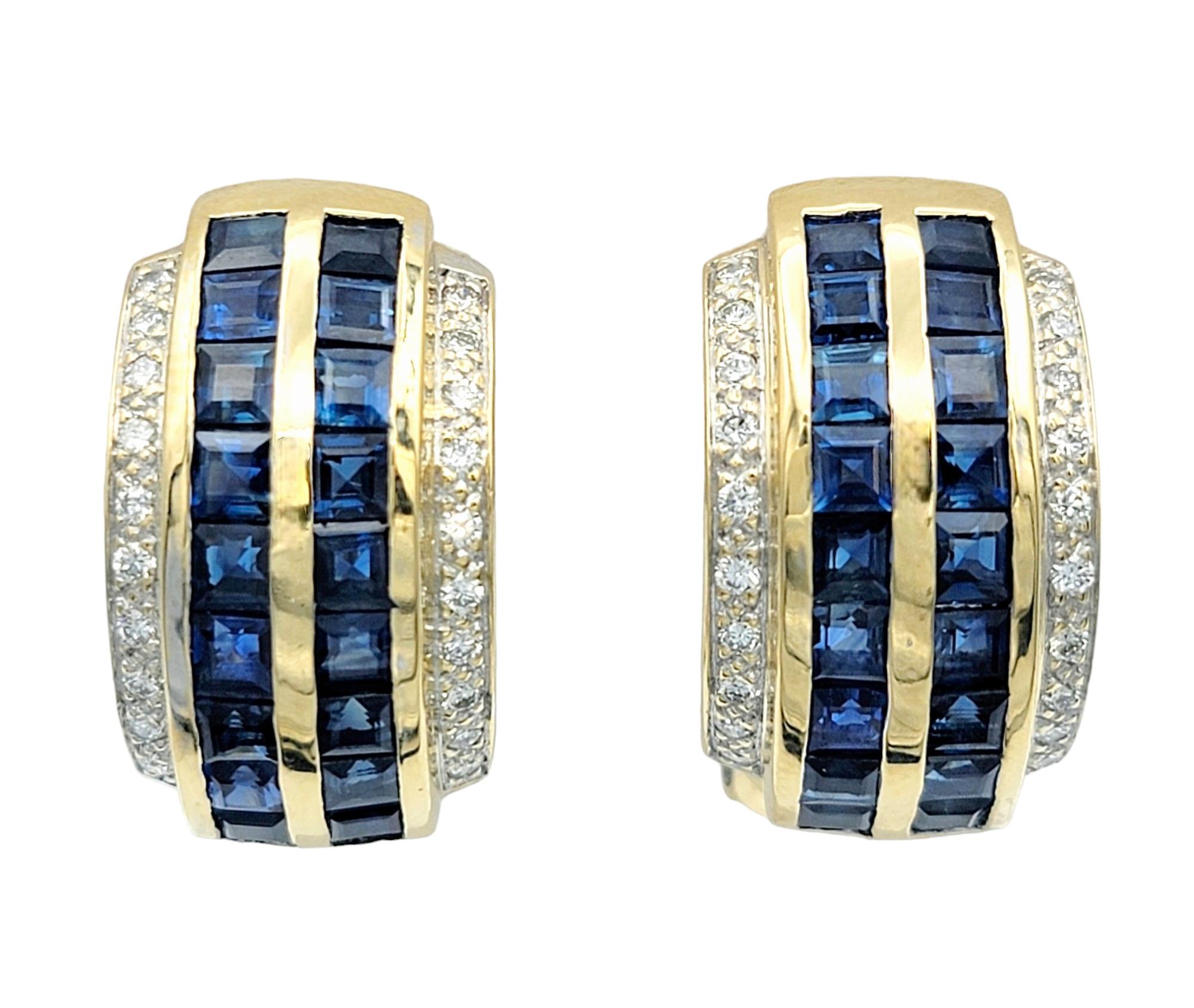 This unique pair of J-hoop earrings, crafted in radiant 14 karat yellow gold, is a stunning and sophisticated accessory. The center of each hoop features two rows of princess-cut sapphires, adding a vibrant and elegant touch to the design. The