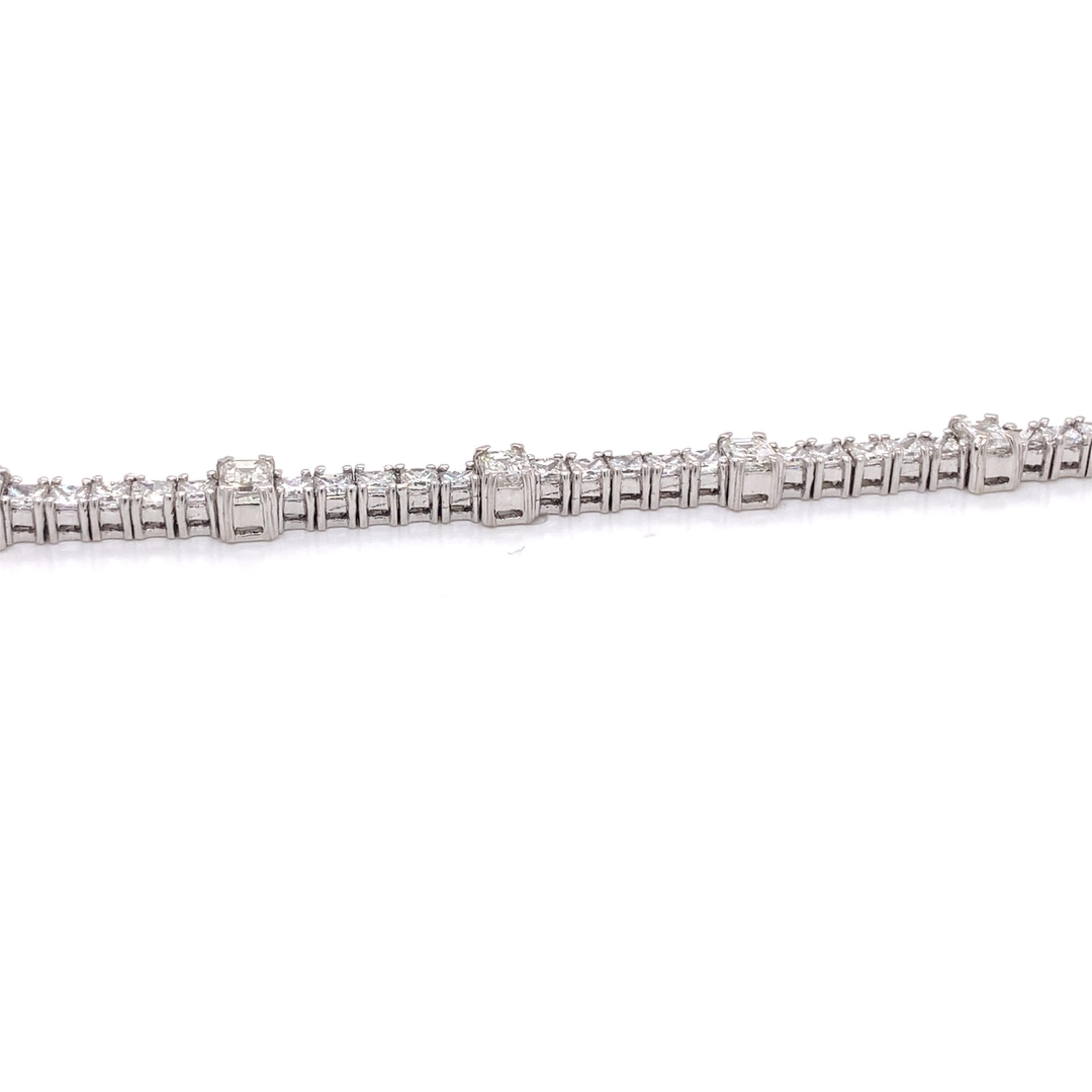 Tennis bracelet made with princess/emerald cut diamonds. Total Diamond Weight: 7.50cts. Diamond Quantity: 65 diamonds (55 princess + 10 emerald cut diamonds). Color: G-H. Clarity: VS. Mounted on 18kt white gold 15.30g. 