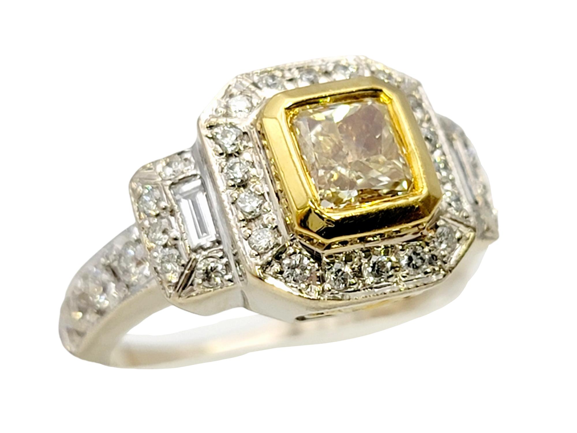 Ring size: 5.5

This stunning two-tone engagement ring will absolutely take your breath away! An exquisite fancy yellow natural diamond is paired with glittering white diamonds for an absolute work of art.  The gorgeous .75 carat princess cut bezel