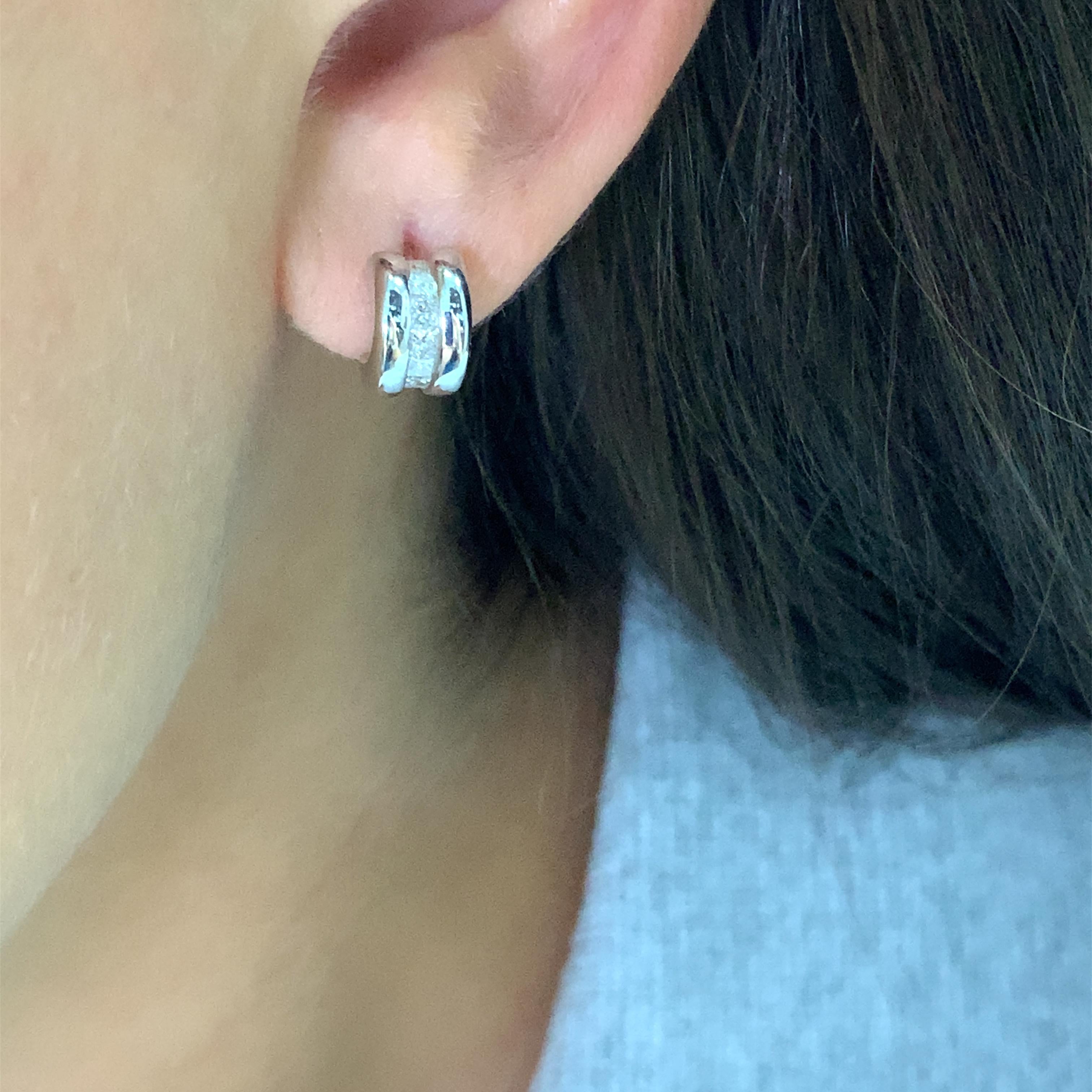Add a touch of elegance to your style with these stunning Diamond Hoop Stud Earrings. Crafted with 18ct white gold, these earrings feature a round shape, butterfly closure, and a total carat weight of 0.78ct. The princess-shaped main stone and the