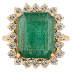 Prinzessin Diana inspiriert 7,22 Karat Smaragd
Diamant Halo Ring in 18K Gelbgold