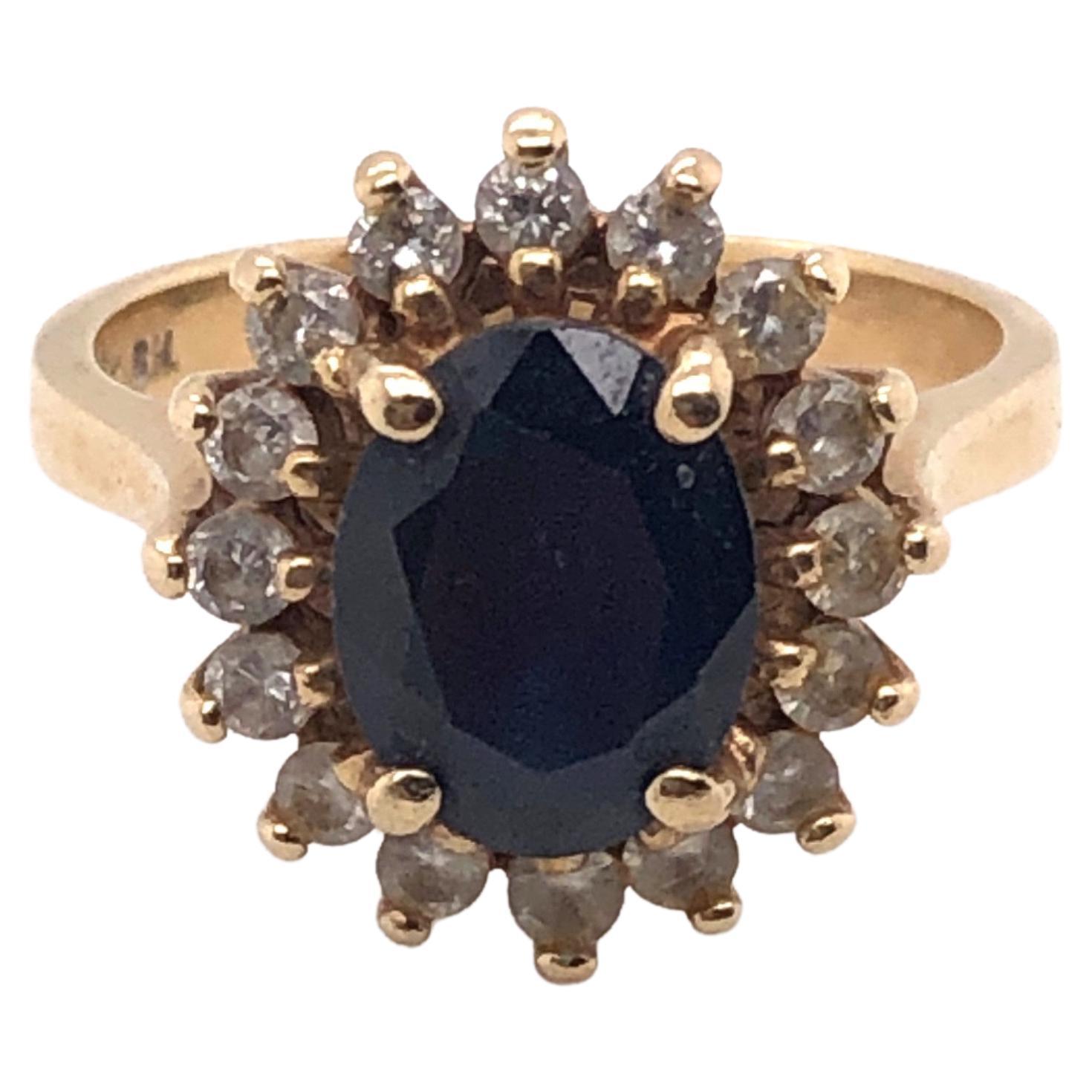 14kt yellow gold 2.68 carat Sapphire with .50 carat H-I color I1-I2  clarity Diamond Halo Ring. 

This is the classic style that Princess Diana had. 

This ring is a finger size 6.25 and can be resized if needed.