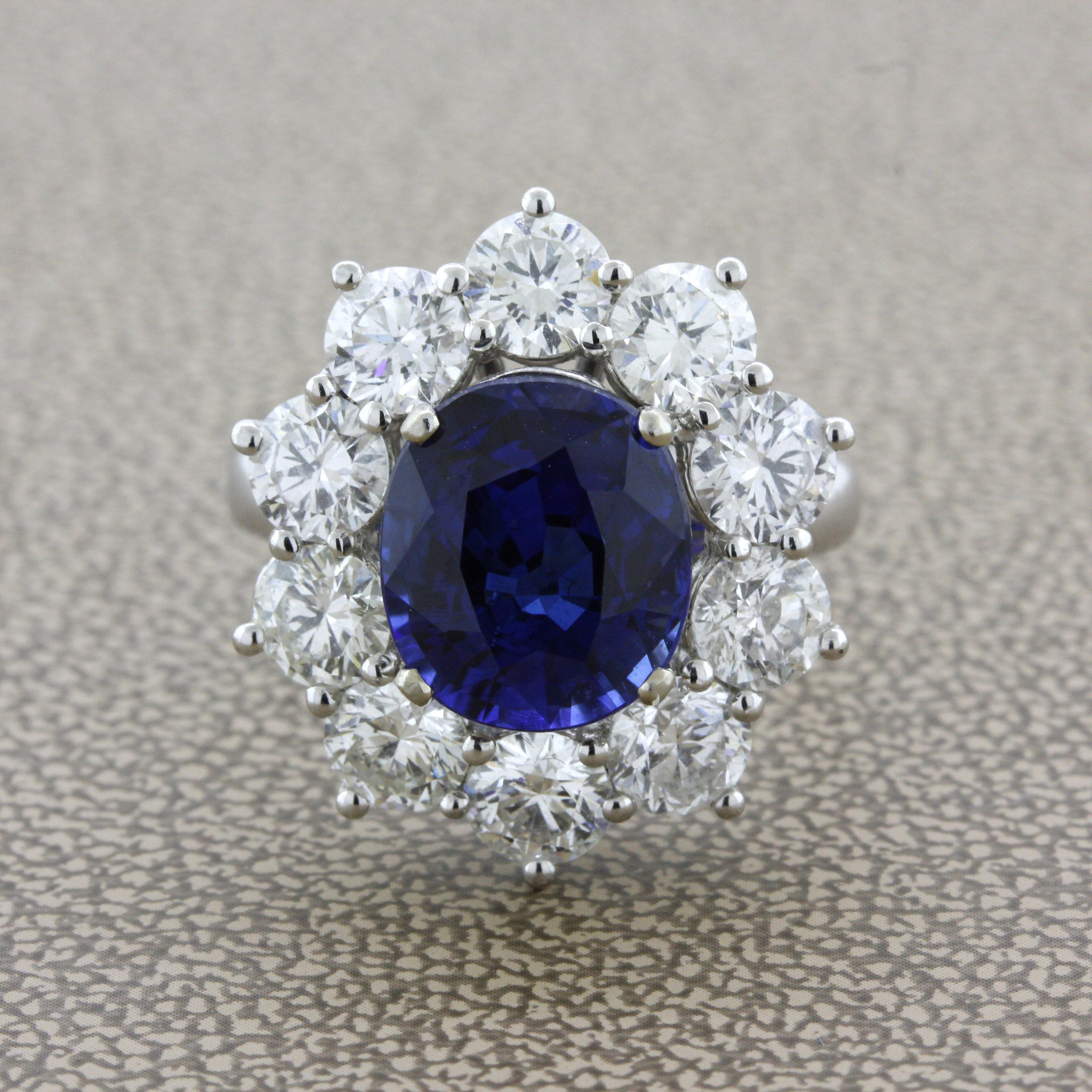 Here we have a rich beautiful blue sapphire set in the middle of this Princess Diana style diamond engagement ring. It weighs 5.18 carats with a rich vibrant blue color along with a lovely oval shape. Adding to that the sapphire is GIA certified and