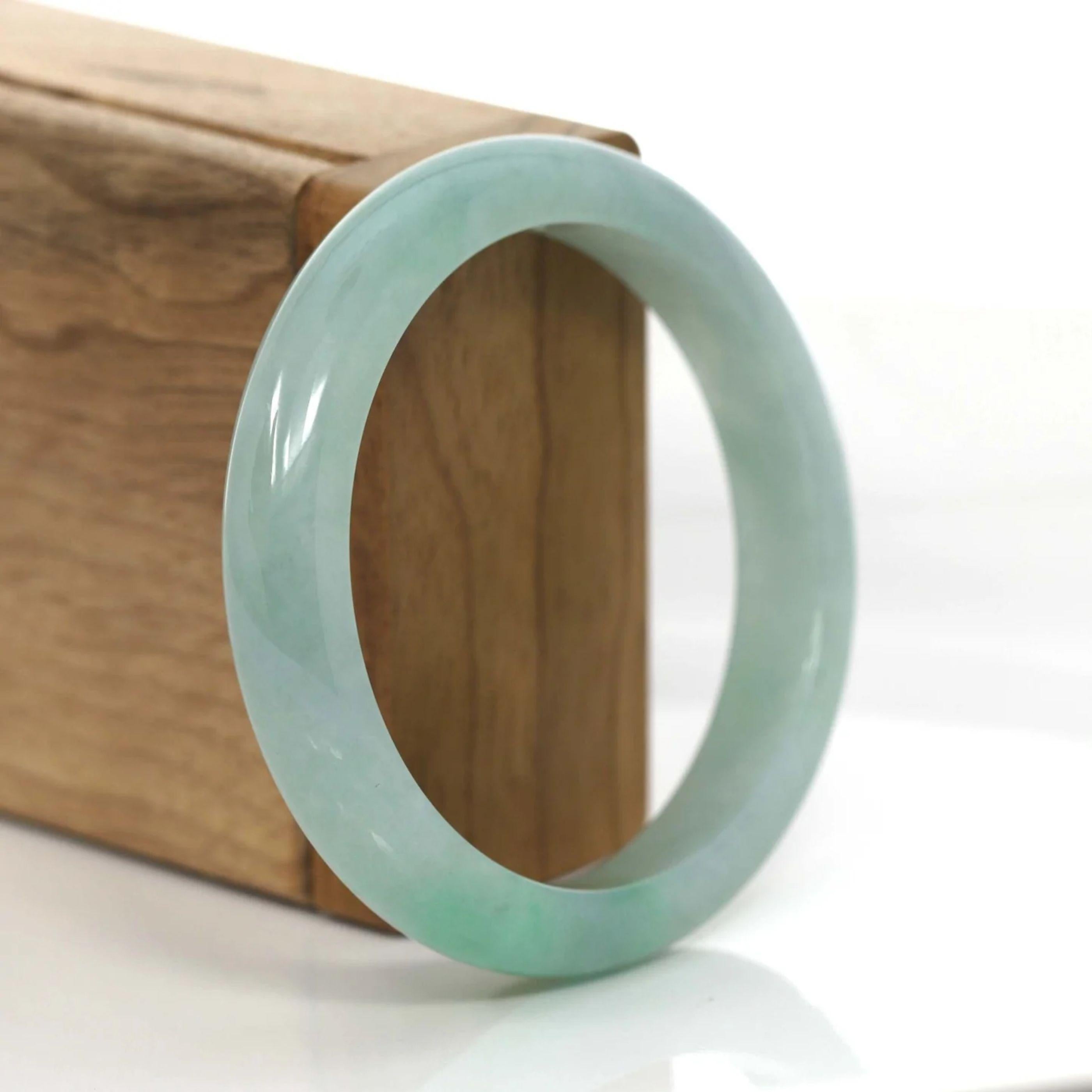 * * DETAILS--- This bangle is made with Burmese ice green jadeite jade. The jade texture is very translucent and smooth. This bangle is made with old mine.  It's an princess half round style. You know the genuine jade bangle is always meaningful for