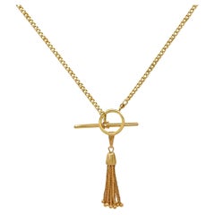 Princess Length Curb Chain with Toggle Closure & Tassel Ornament in Yellow Gold
