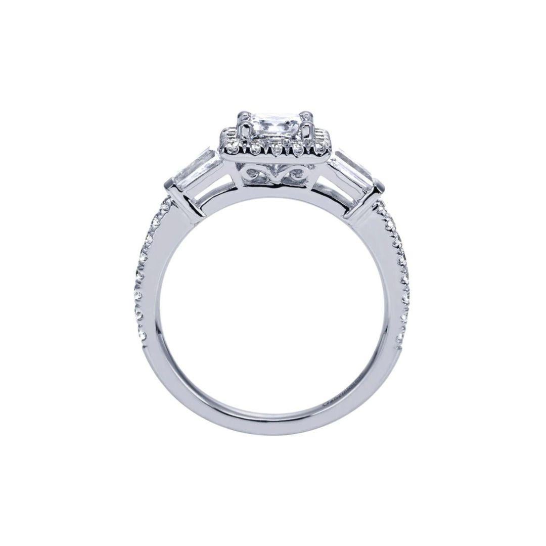 Ladies' Princess 14k White Gold Diamond Engagement Mounting. Princess cut halo holds a round shaped or princess cut stone 7 mm in diameter (center diamond NOT included) Sides are elegant tapered baguettes followed by pave diamonds. Side diamonds are