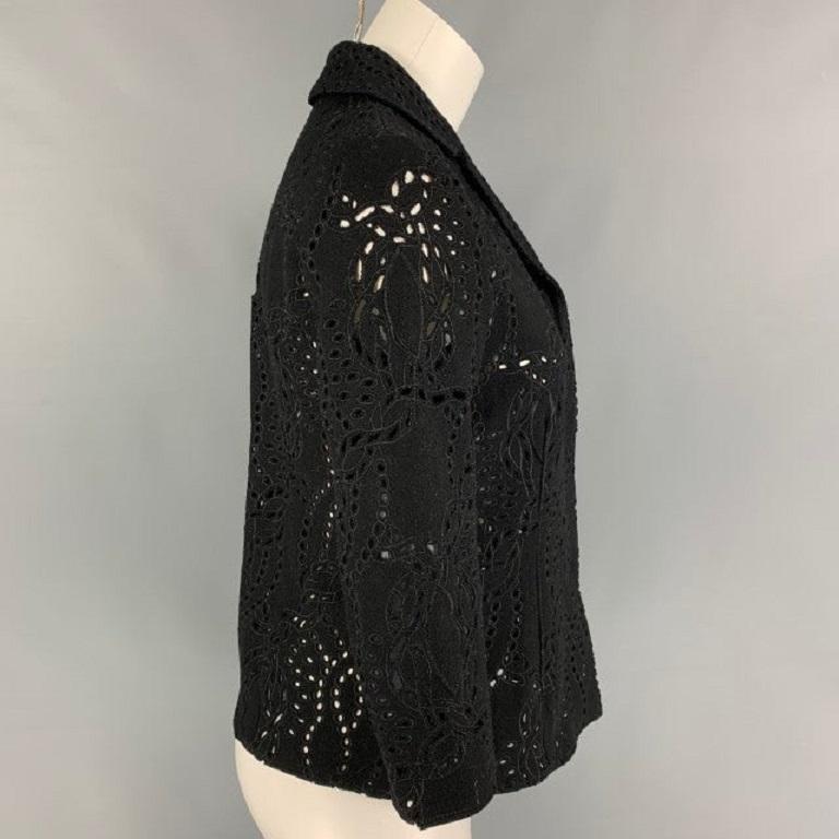PRINGLE OF SCOTLAND blouse comes in a black eyelet wool featuring a notch lapel, 3/4 sleeves, and a snap button closure. Made in Italy.Very Good
Pre-Owned Condition. 

Marked:   6 

Measurements: 
 
Shoulder: 15 inches  Bust: 33 inches  Sleeve: 18