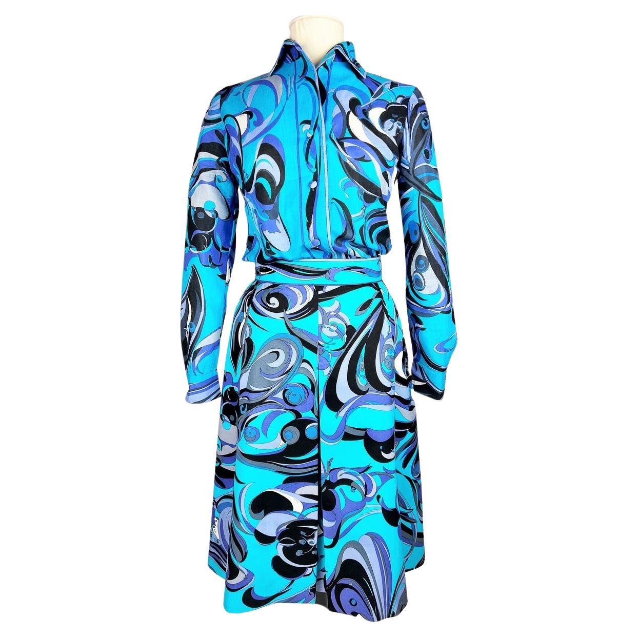 Circa 1970 - 1980
Italy
Blue-printed cotton blouse and skirt set from the famous Emilio Pucci fashion house in Florence, dating from 1970/80. Long-sleeved, slim-fit blouse in cotton voile printed in shades of turquoise to lavender blue and
