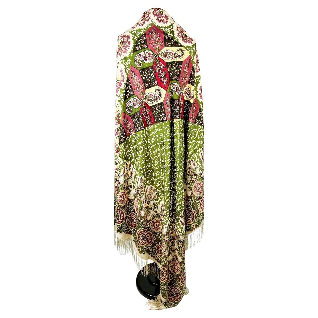 Circa 1860-1880
France or England

Beautiful square shawl in damask and printed silk taffeta with two different designs inspired by the so-called four seasons shawls. Architectural and harlequin caisson design combining stylised palmettes and