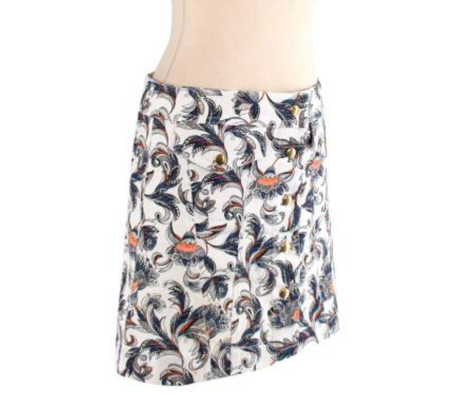 Louis Vuitton Printed denim button-down mini skirt
 
 - White denim mini skirt with all over orange, blue and black printed floral pattern
 - Branded snap button fastenings down the front opening
 - Flap pockets on either side 
 - Diagonal seam