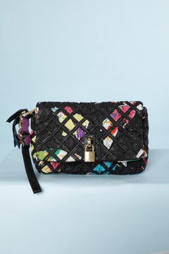 Printed fabric and black nylon clutch with gold metal branded locker Marc Jacob