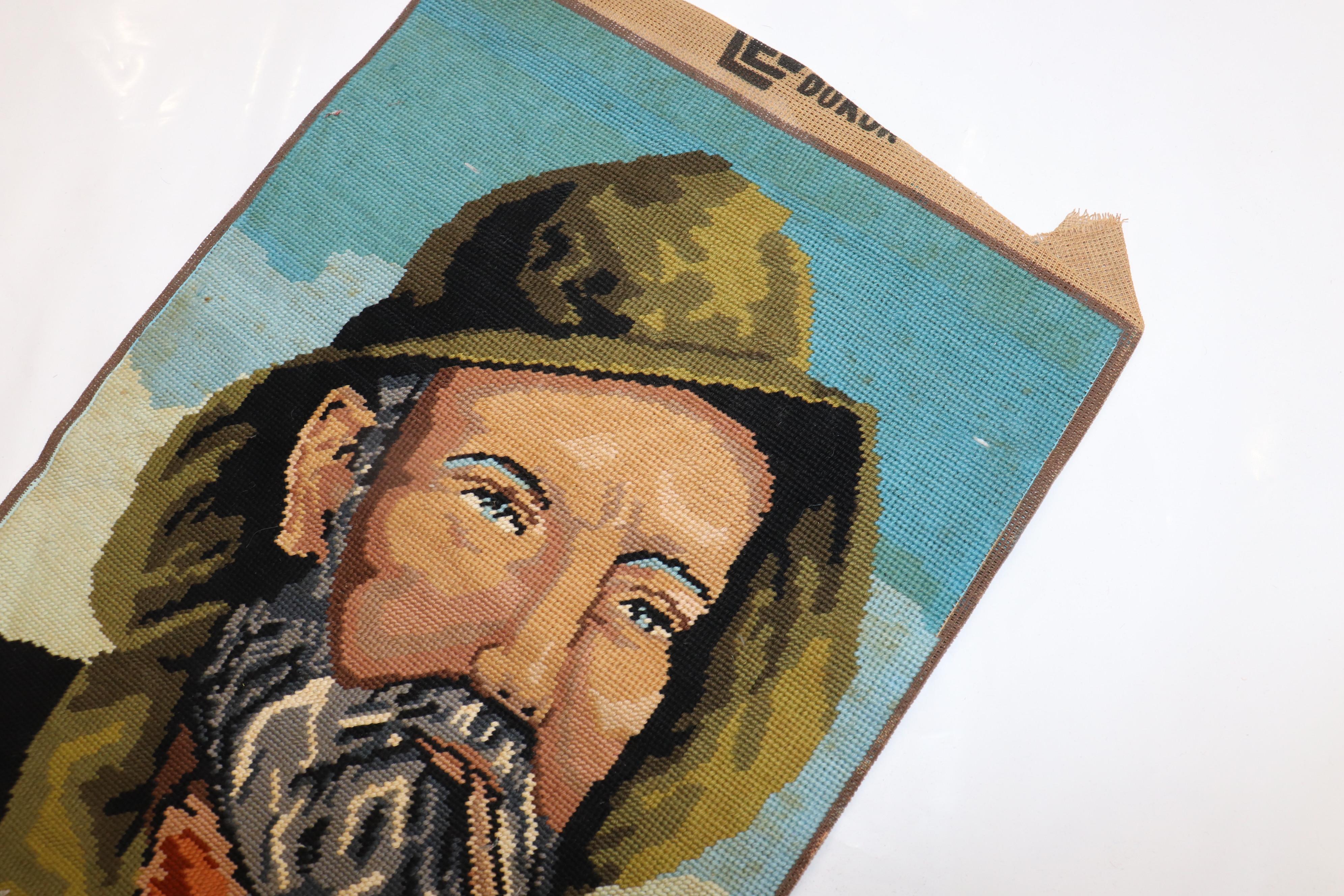 A printed one of a kind Israeli Needlepoint with a man smoking a cigar.

14'' x 20''