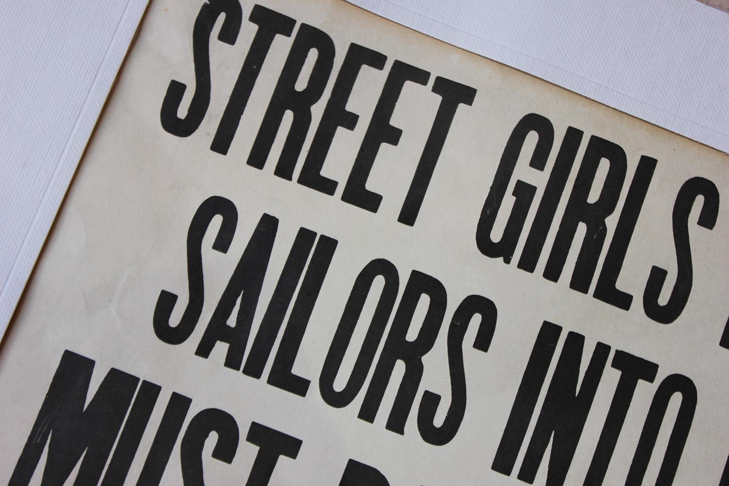 In the typically bold font of the WWII era, the black printed and framed notice reading ‘Street girls bringing sailors into hotel must pay for room in advance, Palace Hotel, Norfolk, VA’ and surviving from the second quarter of the 20th