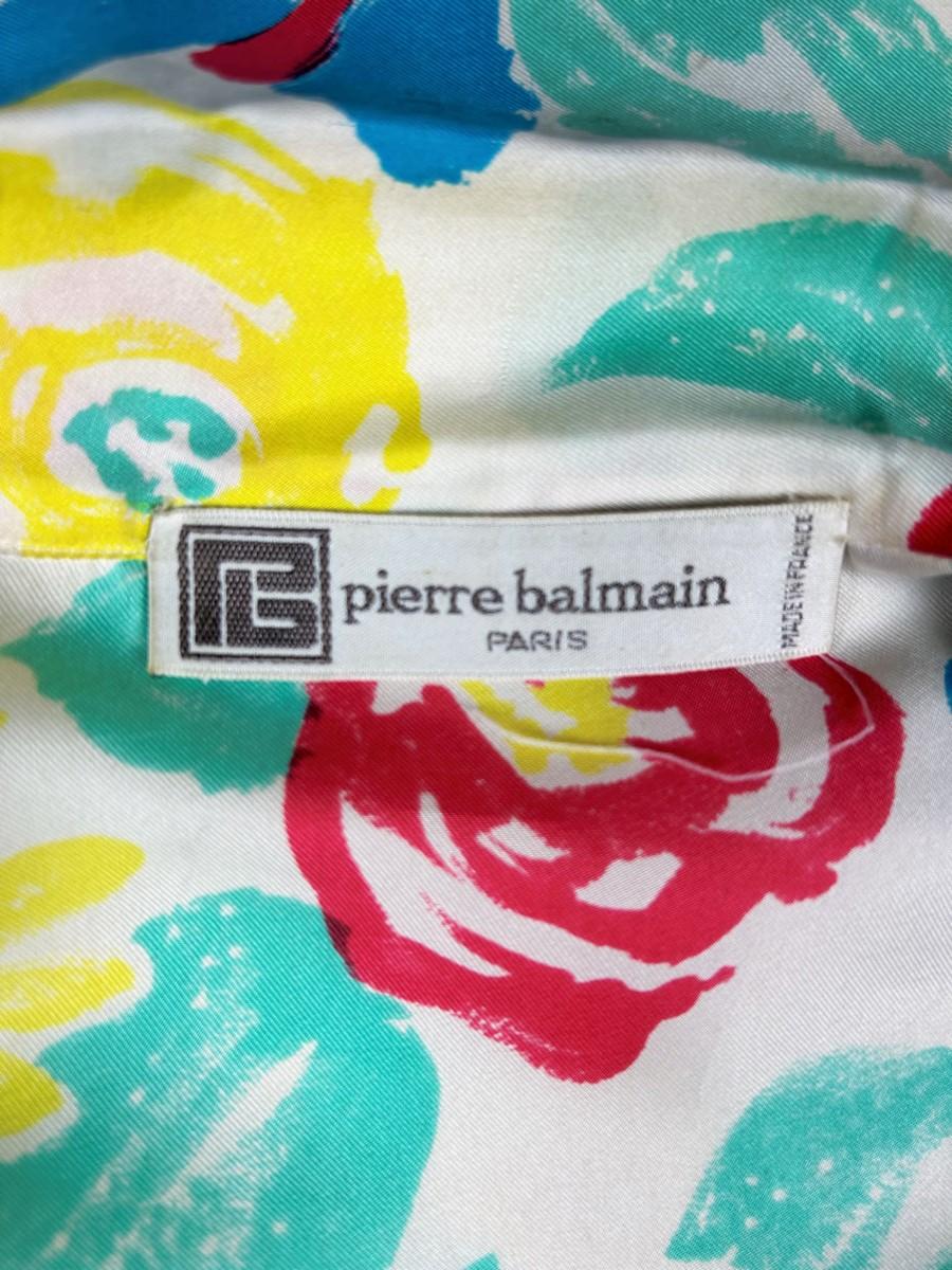 Circa 1985

France

Elegant blouse in printed silk twill by Pierre Balmain dating from the 1980s. Very fine quality, very supple French silk (100% silk) with large impressionist flowers and acid vermilion, sky-blue, blue and yellow colours. Straight
