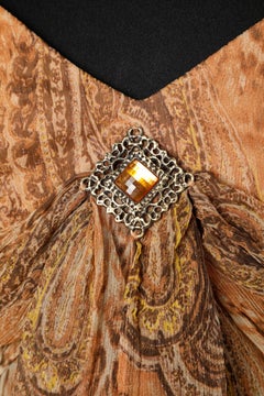 Printed silk chiffon cocktail dress with brooch in the front Luis Spagnoli