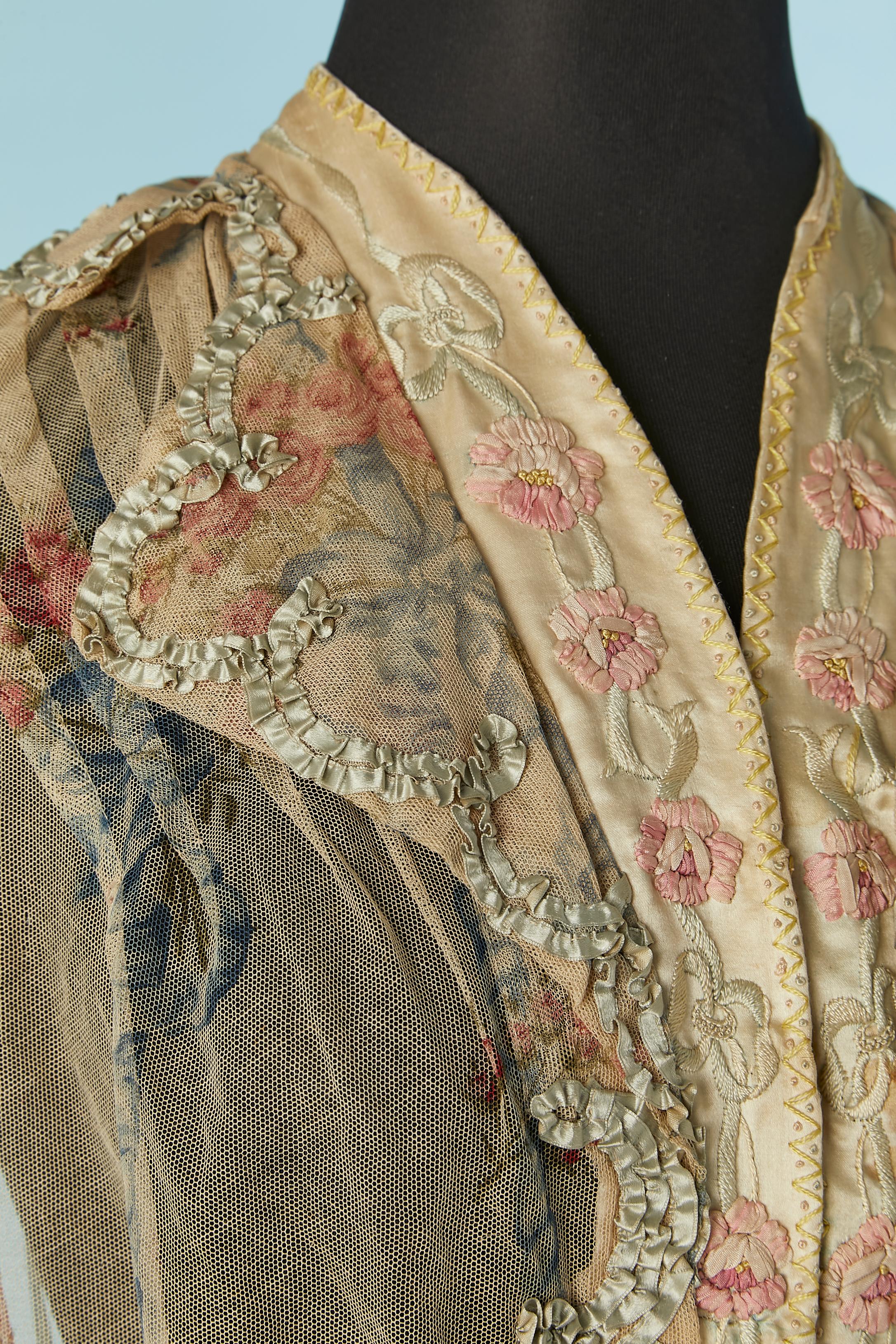 Printed tulle jacket with ribbon, flowers and threads embroideries. Hook&eye closure in the middle front and boned in the middle front ( along the hook&eye) 
SIZE 34 (Fr) XS 