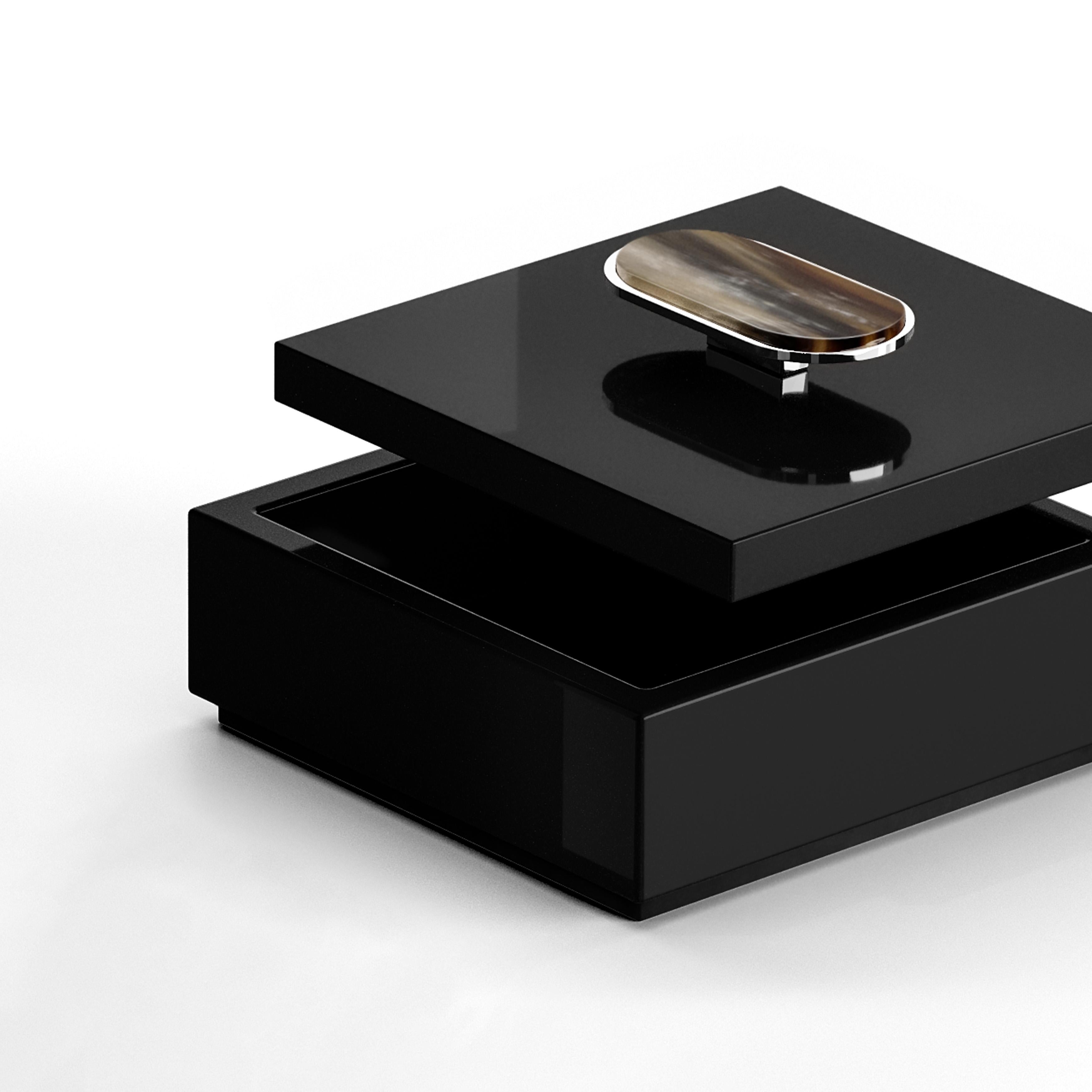 The Priora box exudes refined aesthetic and meticulous attention to detail, making it the ultimate accessory to store your personal belongings. Crafted from glossy black lacquered wood, the box features an elegant lid adorned with a delicate detail