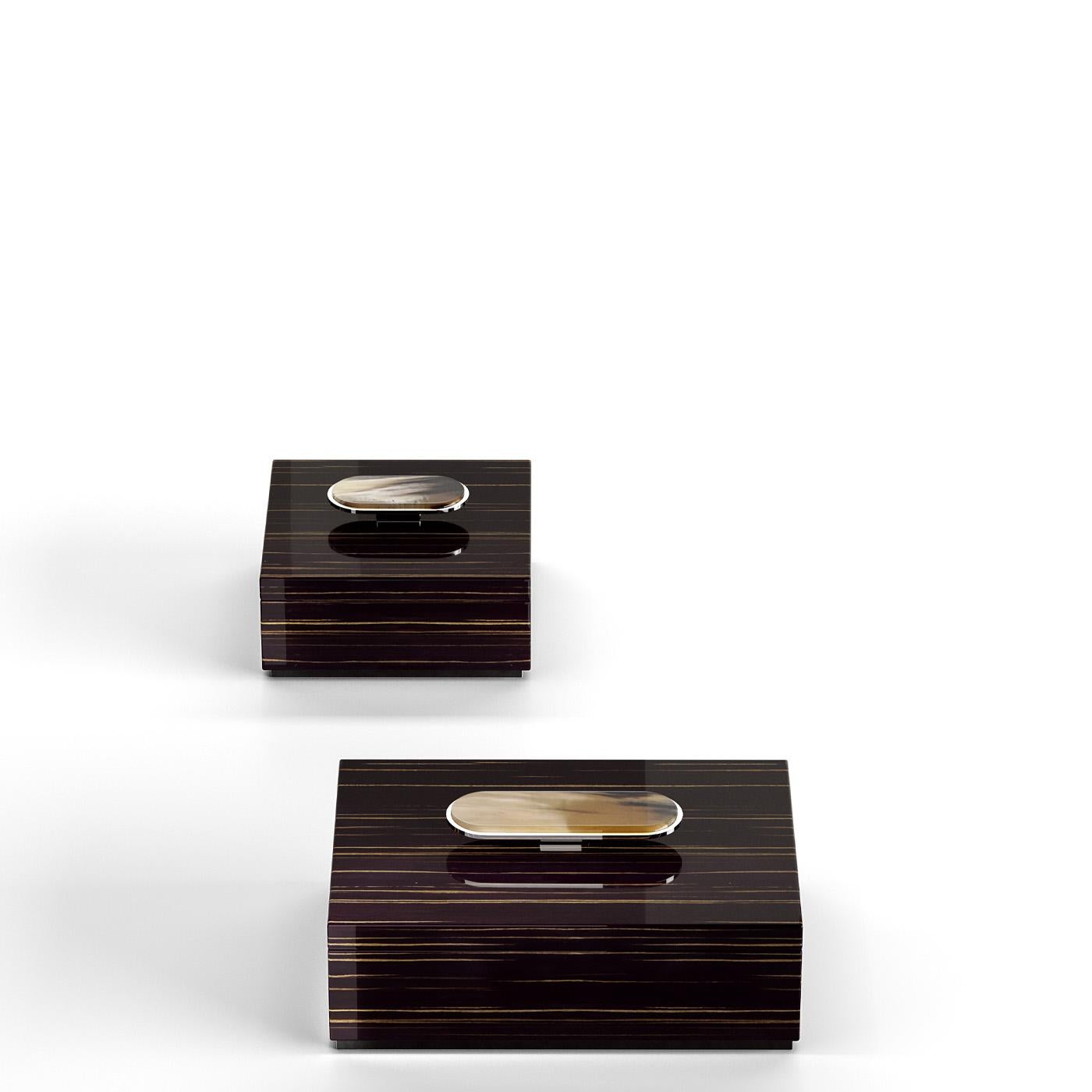 The Priora box is designed to provide an exquisite storage solution for small items. Fashioned from glossy ebony, each box is distinguished by an elegant detail in Corno Italiano and chromed brass decorating the lid. What sets Priora apart are the