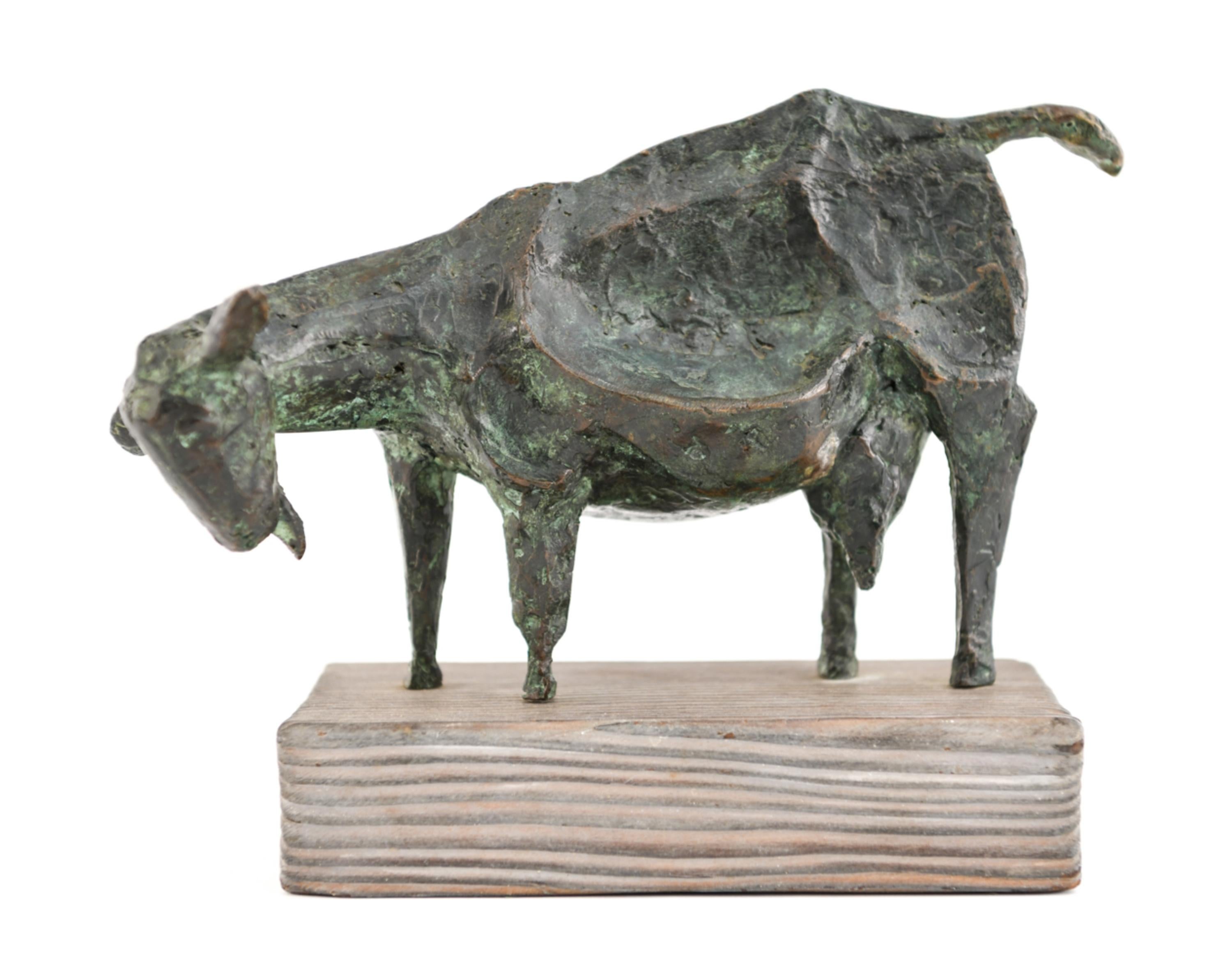 A patinated bronze brutalist sculpture of a goat, by American artist Priscilla Pattison (1919-2013). Signed to back. This brutalist goat has an interesting form and sits upon a charming, rustic wooden base. Signed on back.