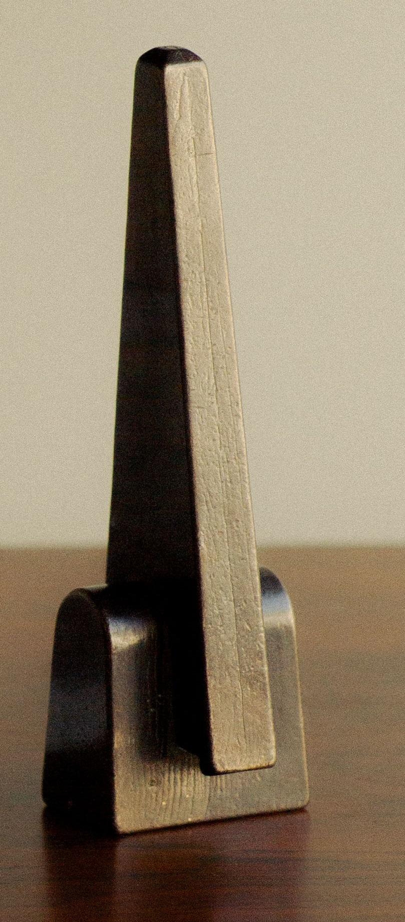 Prise Patinated Bronze Bottle Opener by Henry Wilson
Dimensions: W 3,6 x D 3,5 x H 12 cm.
Materials: Bronze.

Available in patinated and blackened finishes. Please contact us.

Prise Bronze Bottle Opener’s design embodies a playful ambiguity,