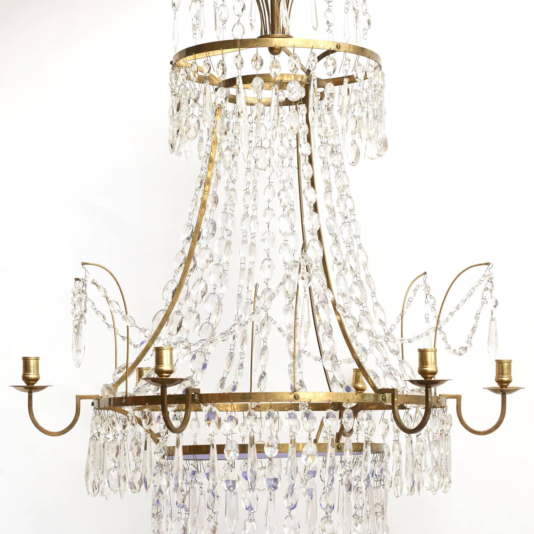 Crystal chandelier Louis XVI Style.
6 Arm Crystal Chandelier with Brass frame.

Prisms with blue glass bottom.
Copenhagen approx. 1900.
 