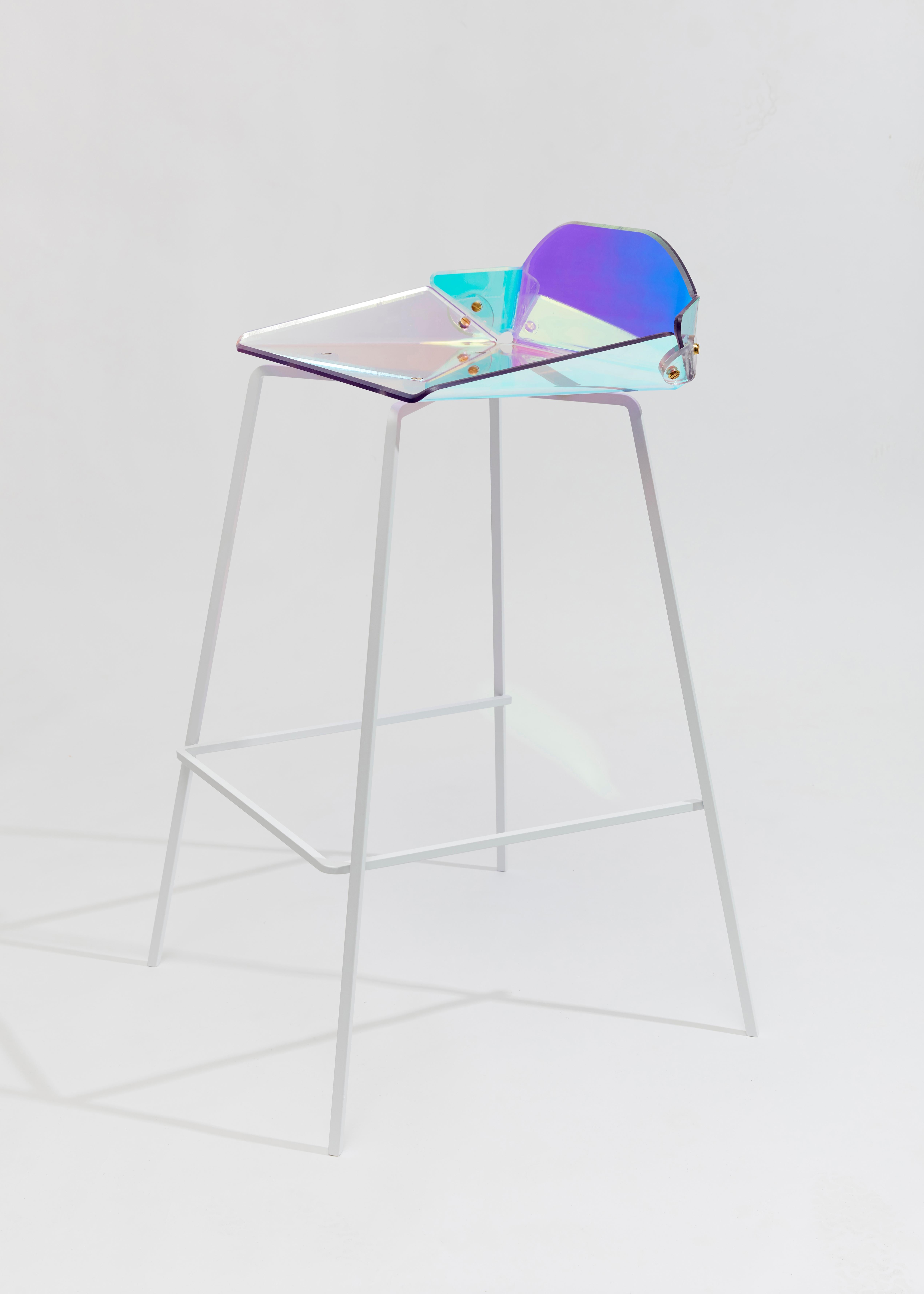 Prismania bar stool signed by Elise Luttik
Dimensions: D 54 x W 50.5 x H 88.5 cm
Materials: Polycarbonate transparent shell with a prismatic polyester film, steel, epoxy.
Also available with black base.

As a designer Elise Luttik is intrigued by