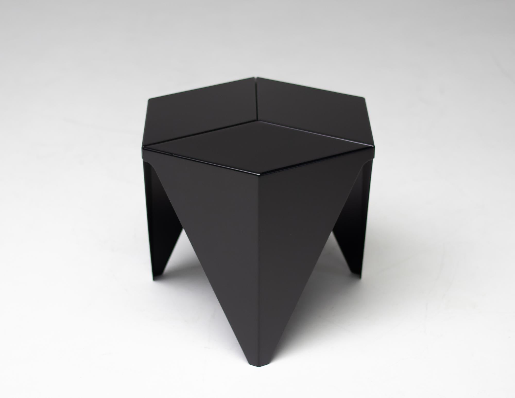 A Prismatic table in black by Isamu Noguchi for Vitra. The table design was based on geometric forms and has an interesting three-legged base with a hexagonal top. Made of folded sheet aluminium inspired by Japanese paper folding techniques.
