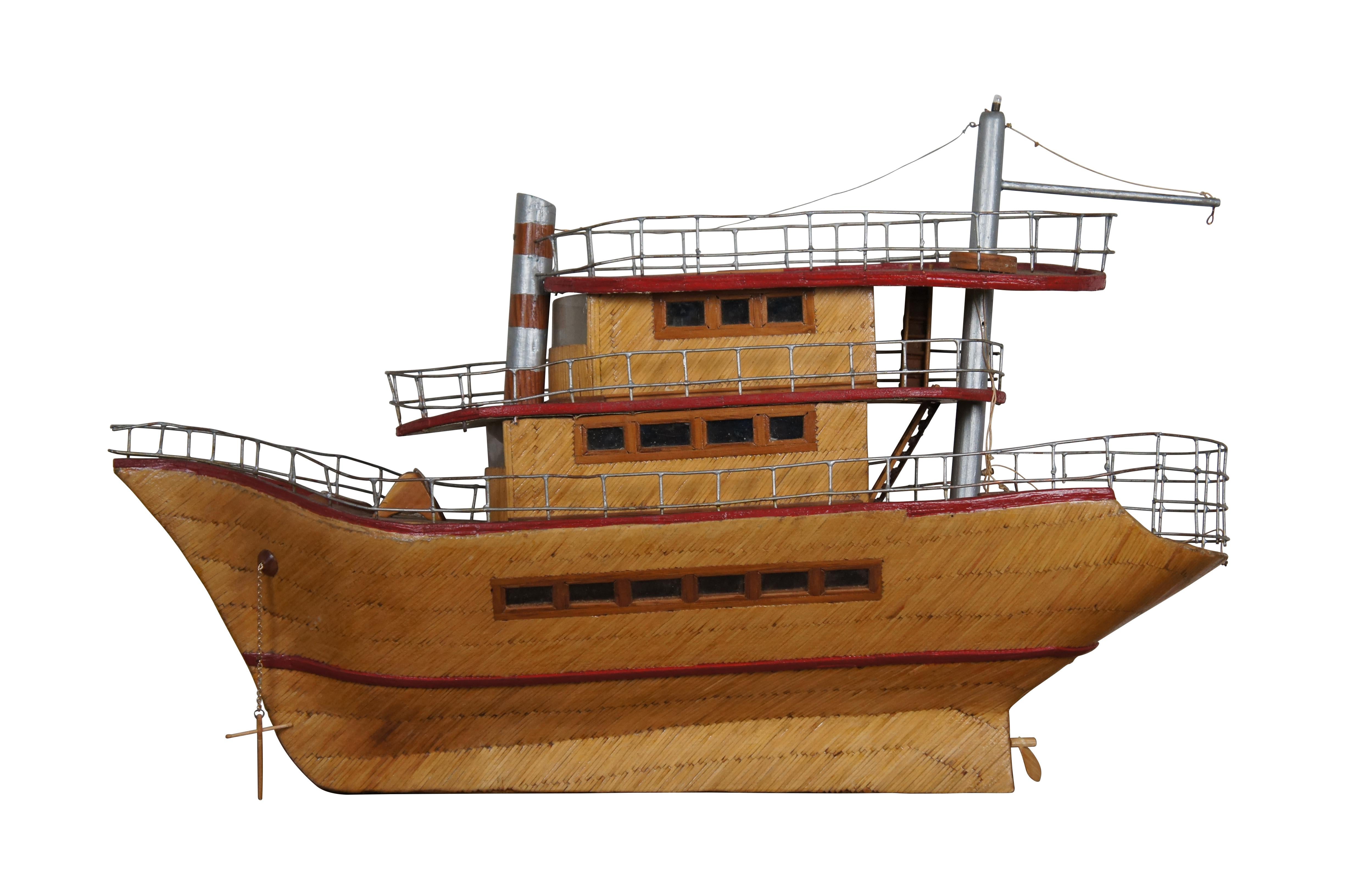 Mid century three tiered prison folk art / tramp art model steam boat sculpture. Upcycled cardboard framing structure, matchstick exterior with glossy finish, red trim, soldered wire railings, plastic windows. interior cabin spaces and hold are