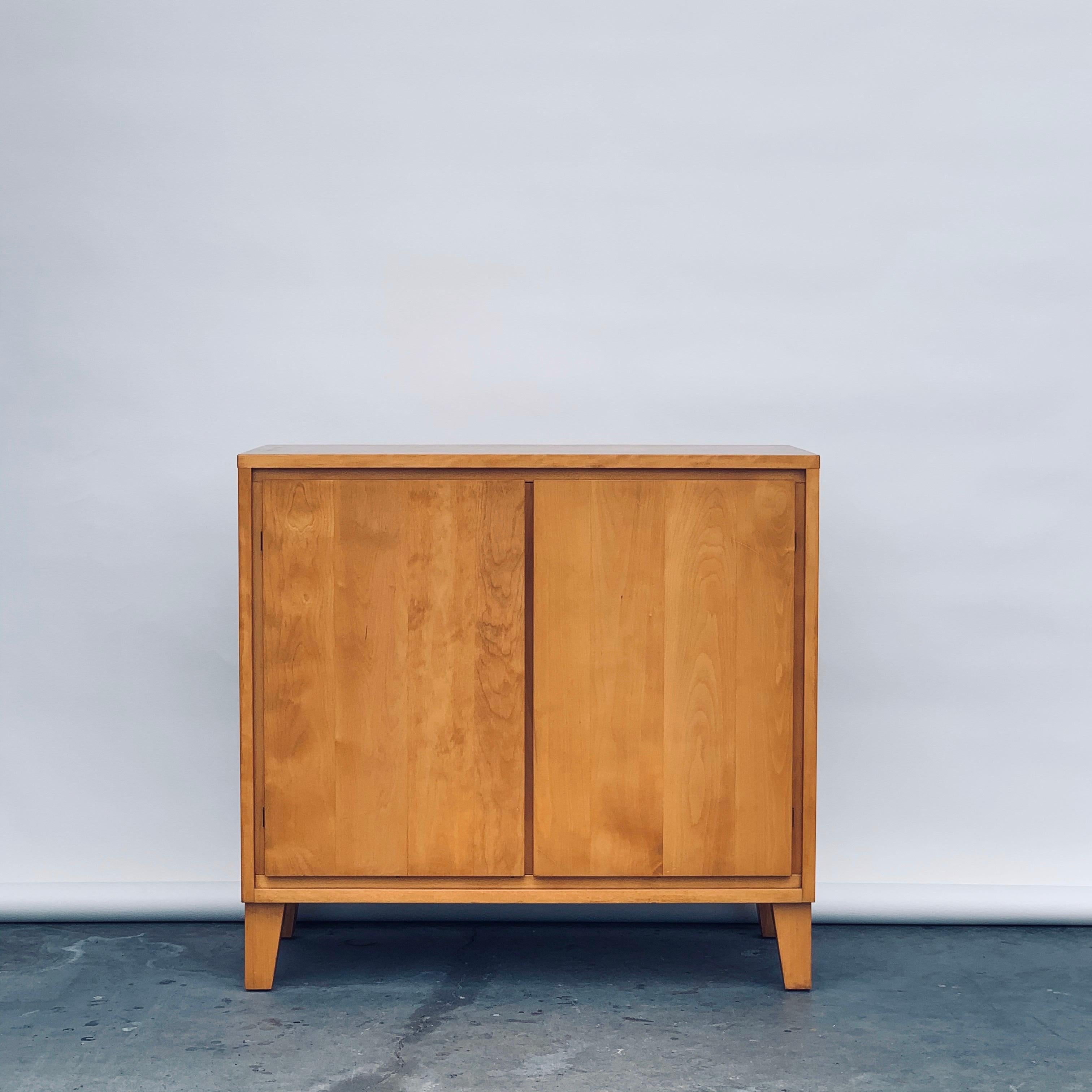 Vintage Conant ball credenza or record cabinet by Leslie Diamond in pristine condition.

This simple, understated record cabinet was designed by Leslie Diamond for the Modern Mates Collection manufactured by Conant Ball of Massachusetts, circa