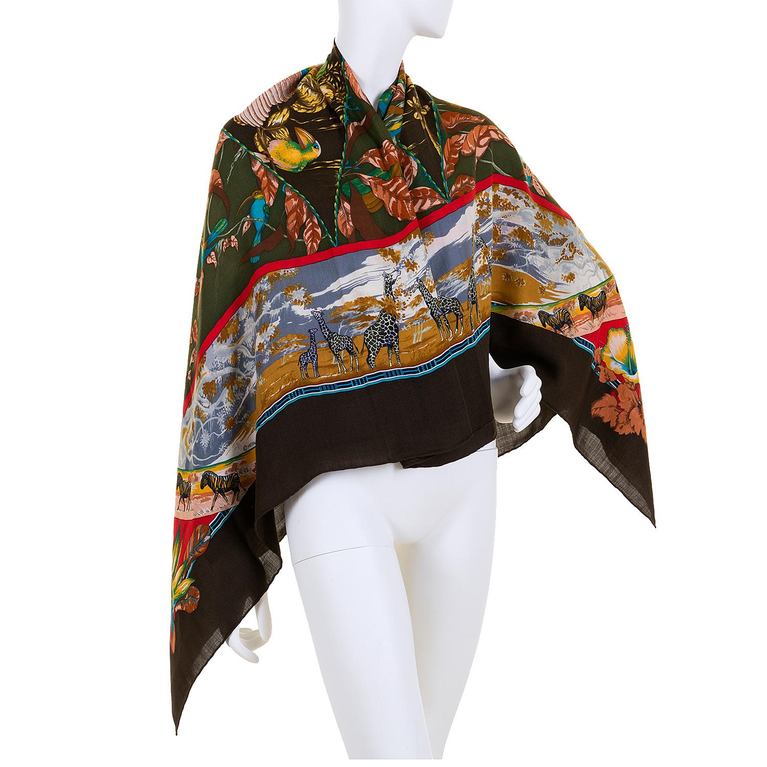 A stunningly beautiful Hermes Cashmere Shawl. In pristine condition, the scarf was designed by the legendary Hermes designer Laurence 'Toutsy' Bourthoumieu, in 1987. Rich, exotic colours are featured on a chocolate brown border. Still with it's