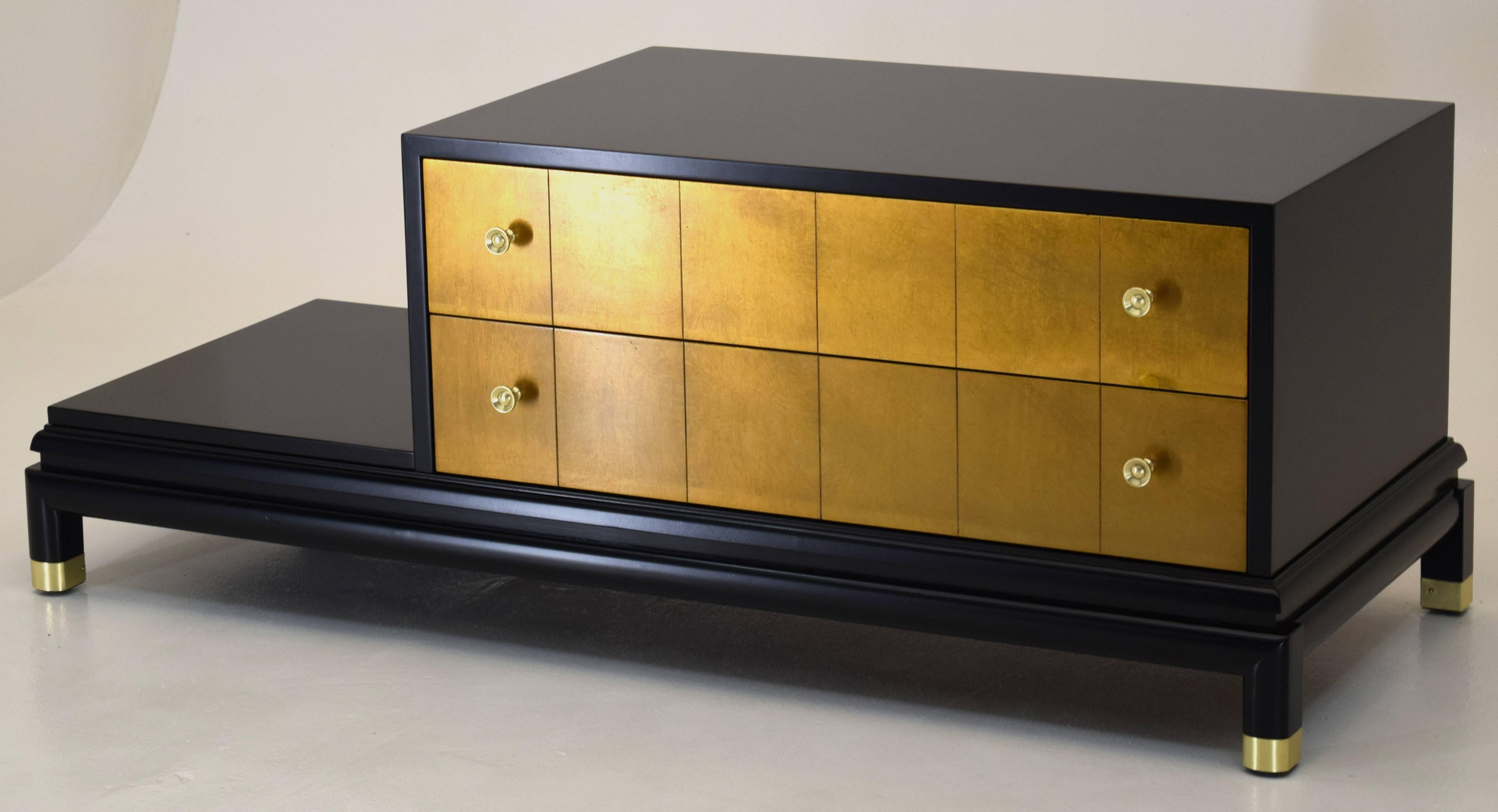 Renzo Rutili for Johnson Furniture
1950s, USA
Black lacquer, gold leaf, brass
Measures: 51 wide x 20.5 deep and 19 inches tall, lower shelf 7.25 inches.

Designed to be free standing in a room likely with chairs either side, these two-tier (or