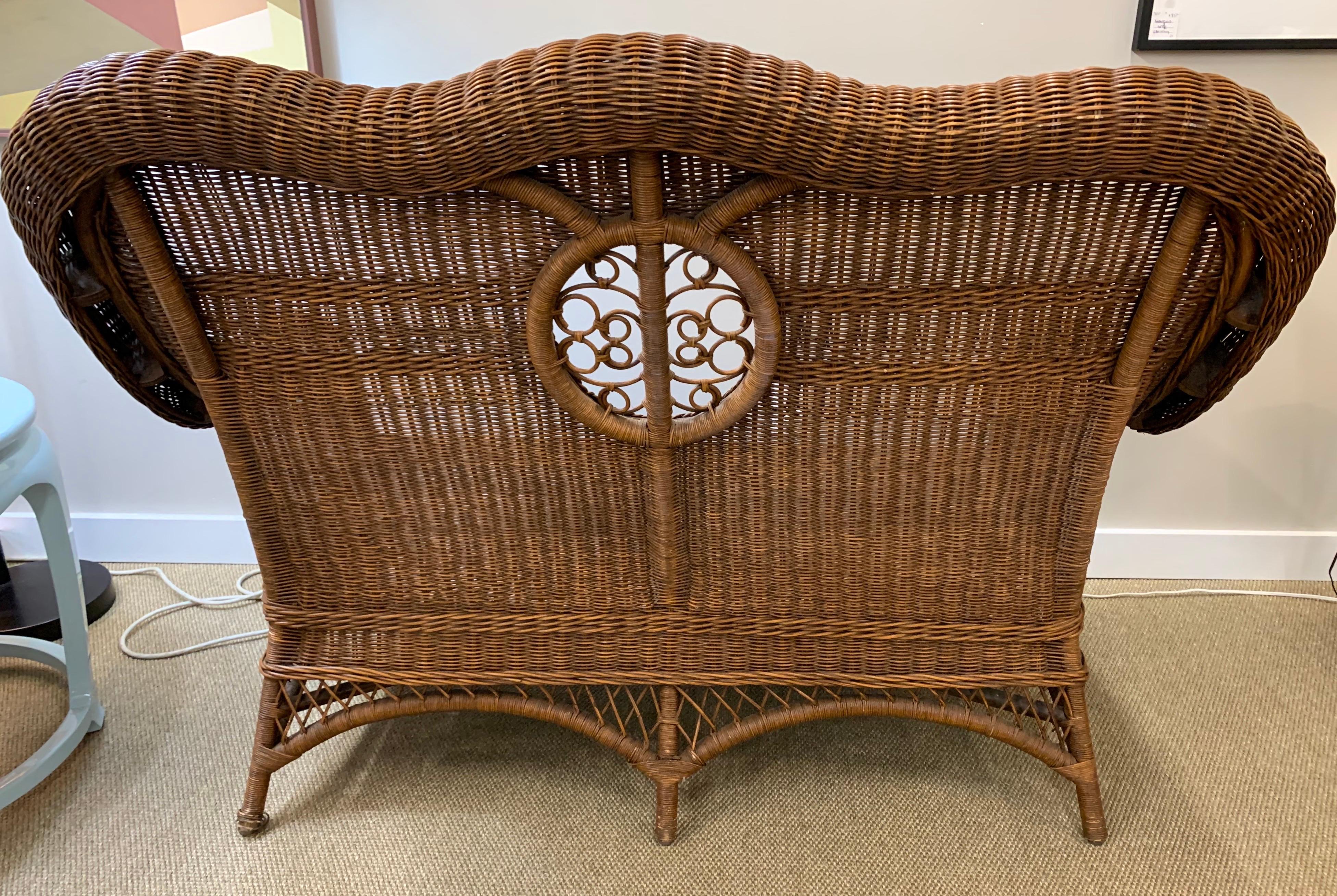 Pristine Wicker Loveseat with Blue and White Upholstered Cushions 1