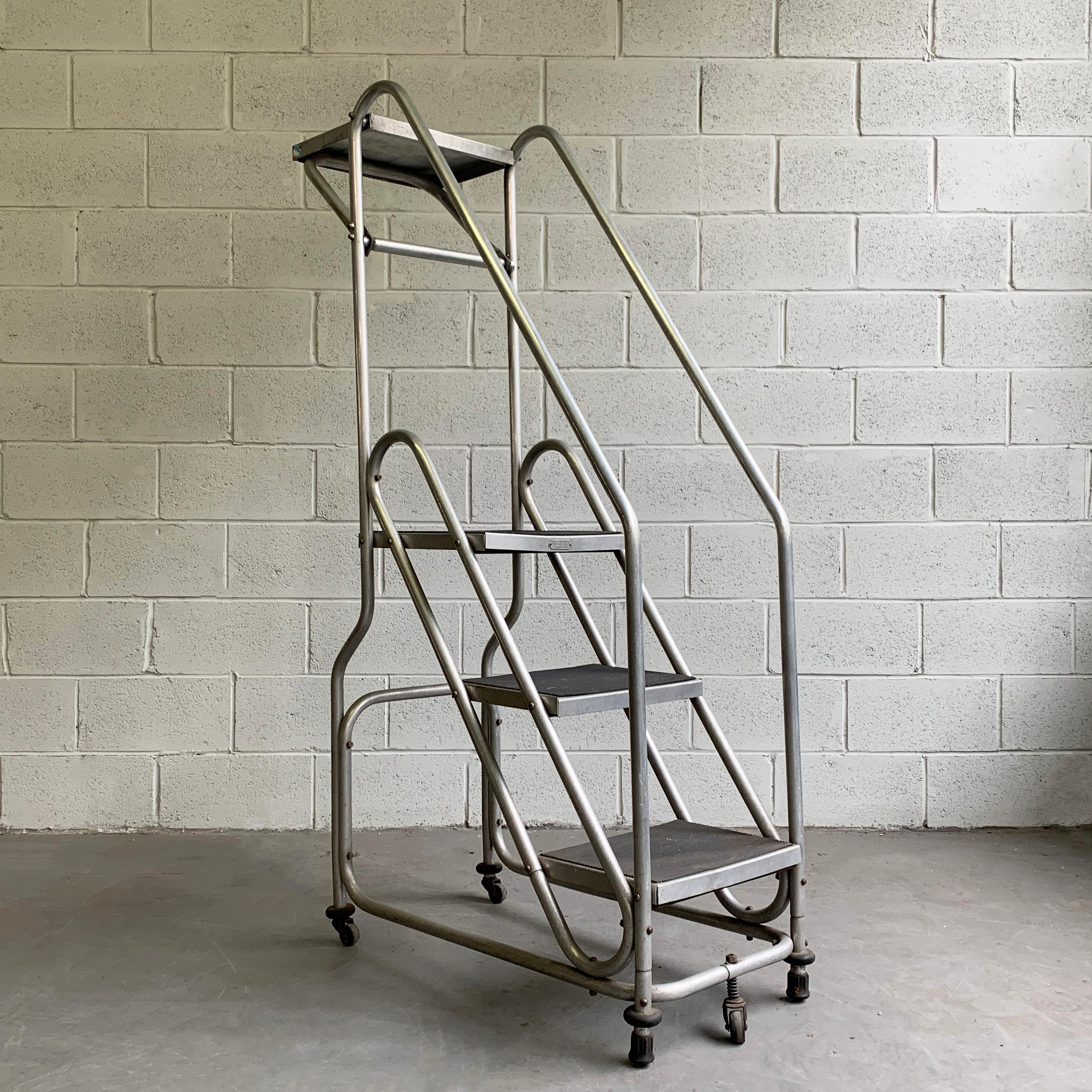 Group sale of 8 industrial pieces consisting of:
(1) Aluminum rolling ladder
(1) Industrial table top shelf
(1) Tall steel mesh hospital stool
(1) Short steel mesh hospital stool
(1) KEM Weber adjustable dentist stool - green base
(1) Early 20th